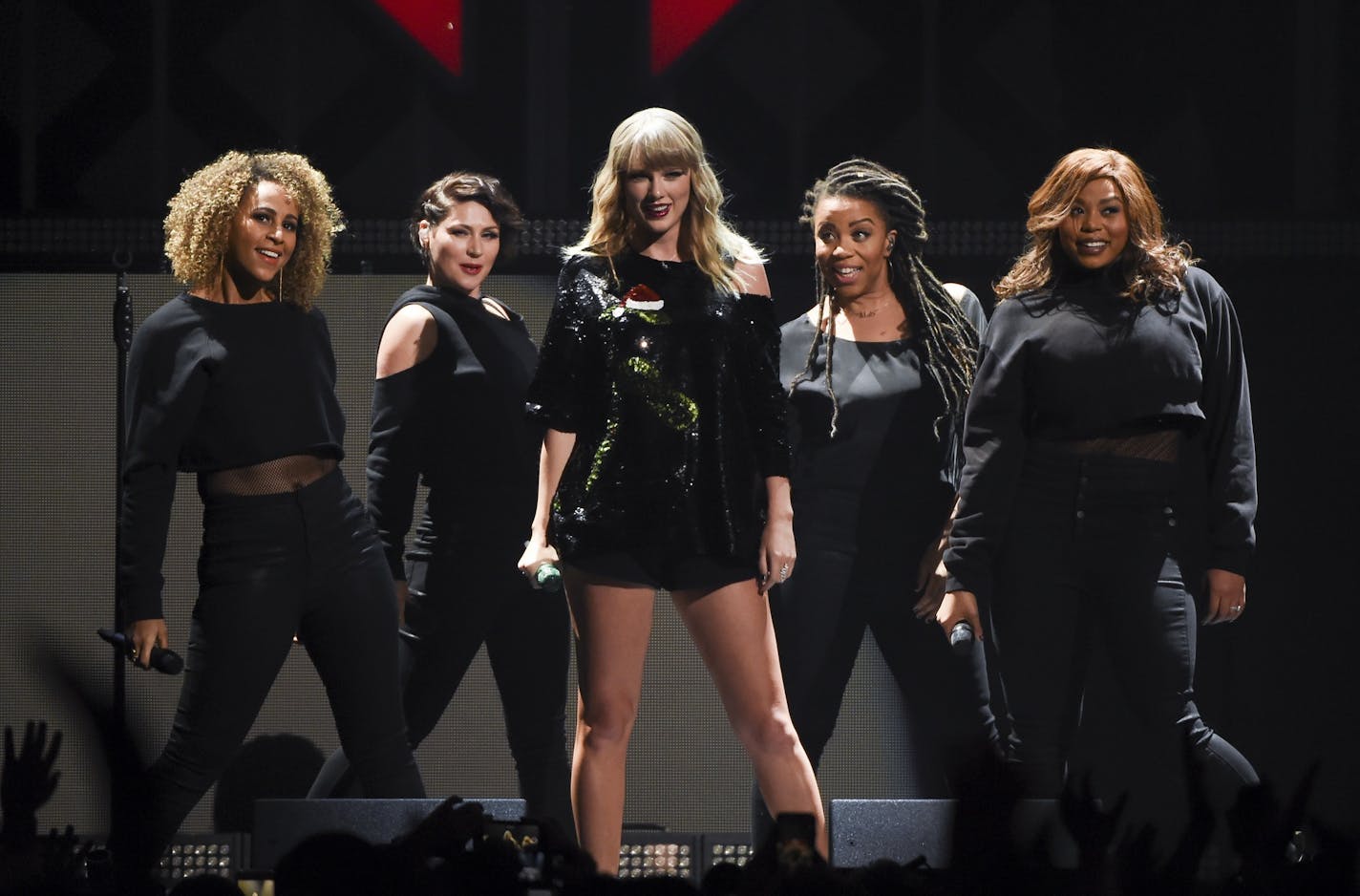 Singer Taylor Swift, center, performs at Z100's iHeartRadio Jingle Ball at Madison Square Garden on Friday, Dec. 8, 2017, in New York. (Photo by Evan Agostini/Invision/AP) ORG XMIT: MIN2017121511503915