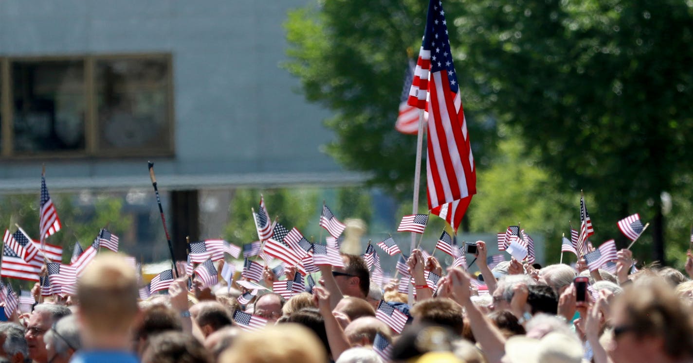 The Rev. Franklin Graham hosted a day of prayer, encouraging the throng of Christians gathered to get out and vote and become involved in politics on the local level Thursday, June 16, 2016, in the lower mall outside the State Capitol in St. Paul, MN. Here, near the conclusion of the event those gathered waved flags while singing "America the Beautiful".(DAVID JOLES/STARTRIBUNE)djoles@startribune The Rev. Franklin Graham hosted a day of prayer at the Minnesota Capitol. These gatherings are going