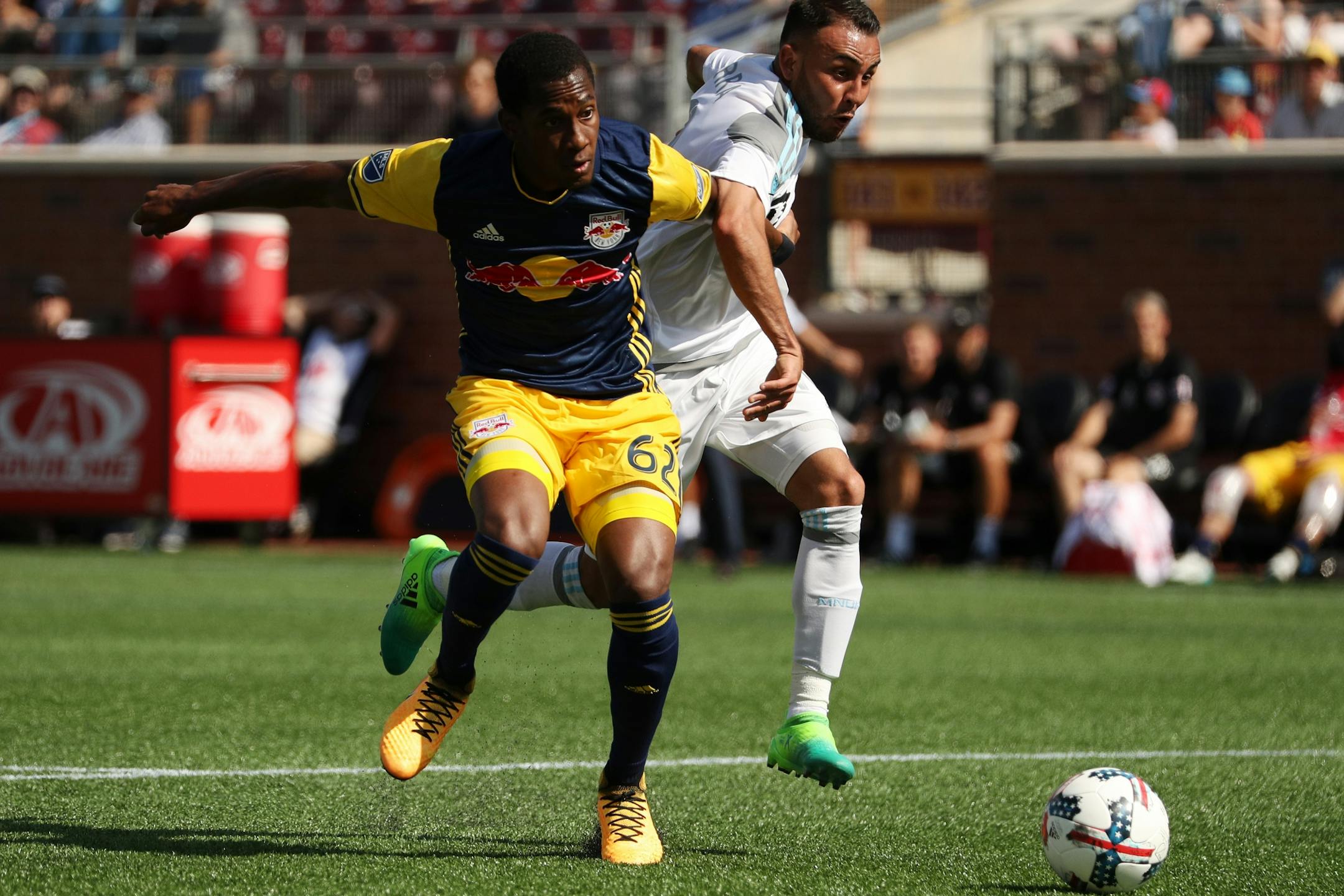 Minnesota United midfielder Miguel Ibarra (10) got tangled up with New York Red Bulls defender Michael Murillo (62) as he dribbled the ball to the New York Red Bulls goal in the second half.