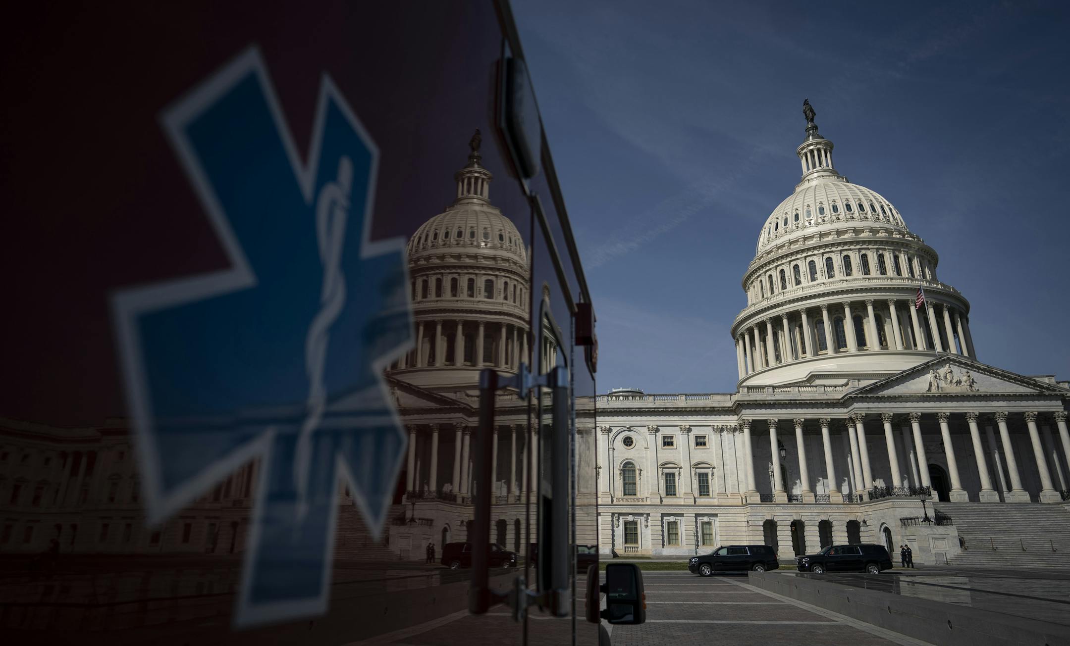 An ambulance sits parked on the plaza outside the U.S. Capitol March 16, 2020 in Washington, D.C. After taking the weekend off, the Senate will return on Monday afternoon and will take up the House-passed coronavirus relief bill. The legislation in the House bill includes some provisions for paid emergency leave and free COVID-19 testing. (Drew Angerer/Getty Images/TNS) ORG XMIT: 1607781