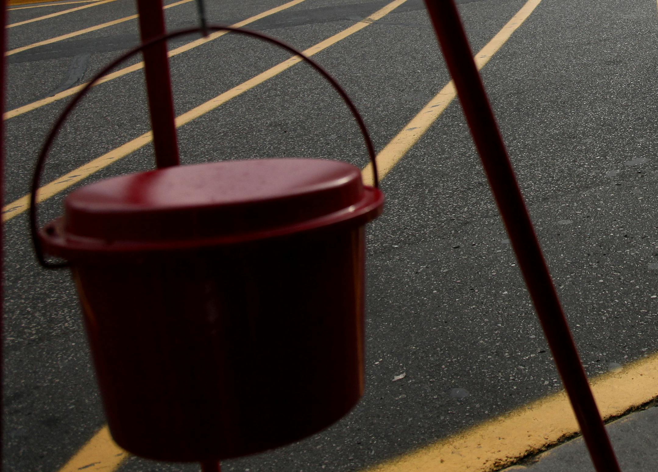 Three-year-old Lauren Walker joined her mother Latrice Jackson to a trip to the Salvation Army kettle to give before they shop at the St. Louis Park Cub Foods, Wednesday, November 9, 2011. (ELIZABETH FLORES/STAR TRIBUNE) ELIZABETH FLORES &#x2022; eflores@startribune.com