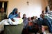 Recent Somali immigrants Nur Ali, right, and his wife Mahado Mohamed, left, sit with their six children Shukri Shukri, from left, 9, one-week-old Ifra