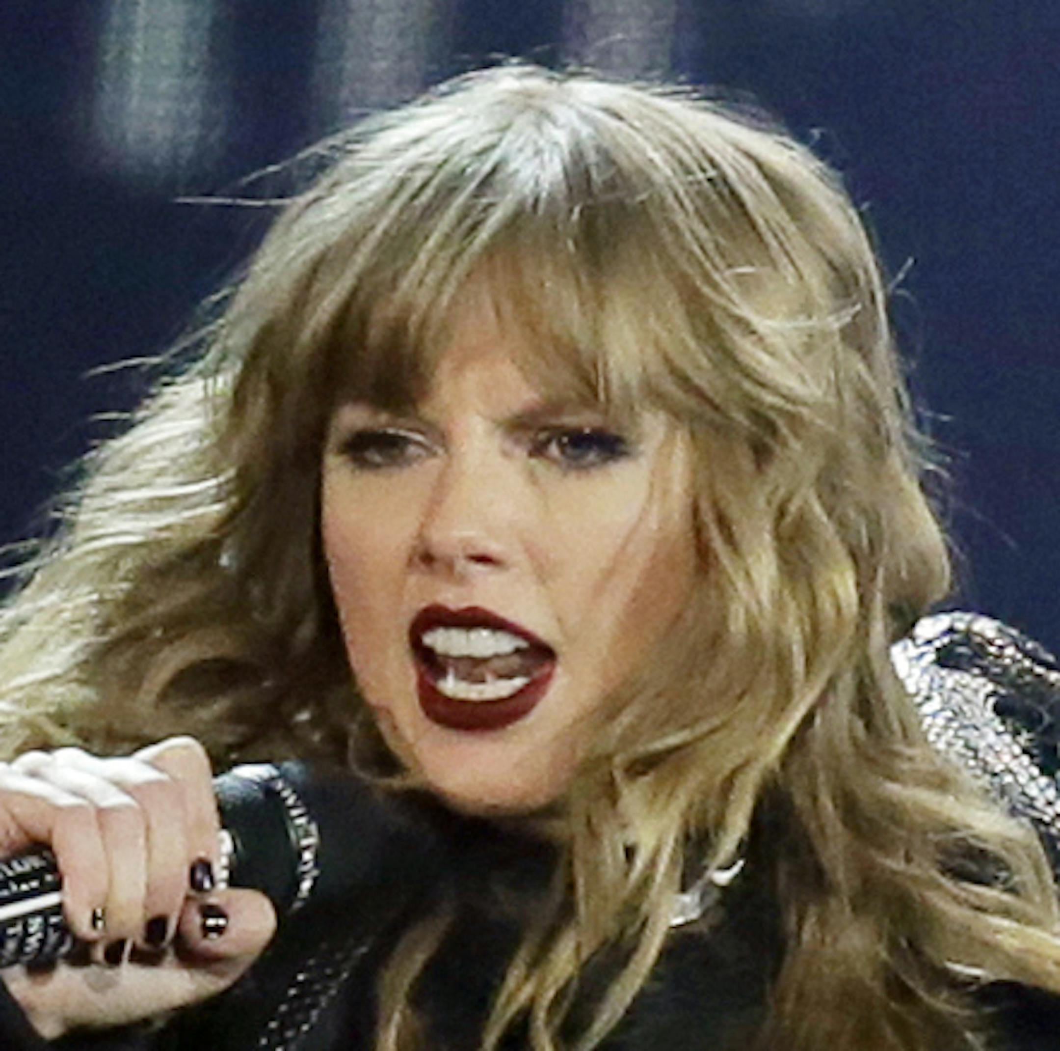 FILE - In this May 8, 2018, file photo, Taylor Swift performs during her "Reputation Stadium Tour" opener in Glendale, Ariz. Swift will open the ì2018 American Music Awards.î The singer made the announcement Tuesday, Oct. 2, on ABCís ìGood Morning America.î (Photo by Rick Scuteri/Invision/AP, File)