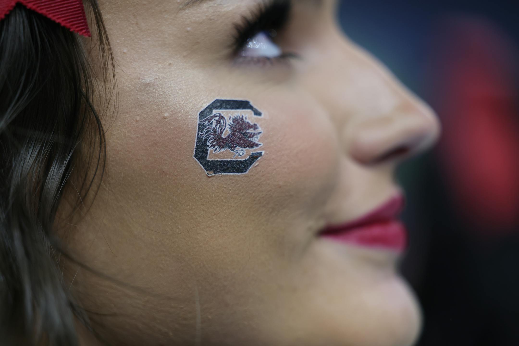 A South Carolina cheerleader smiles during a semifinal game between South Carolina and Louisville.