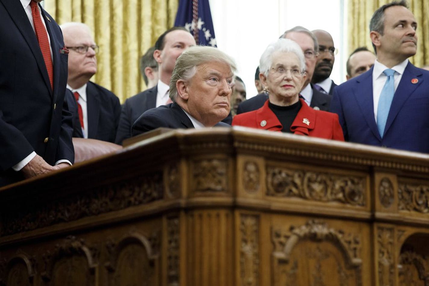 President Donald Trump signs a criminal justice reform bill, at the White House in Washington, Dec. 21, 2018. Trump tried here to pin blame for a potential government shutdown on Senate Democrats, and fallout over the resignation of his defense secretary onto the news media. "We have had a very busy two or three days," Trump said. "It's been very positively positive."