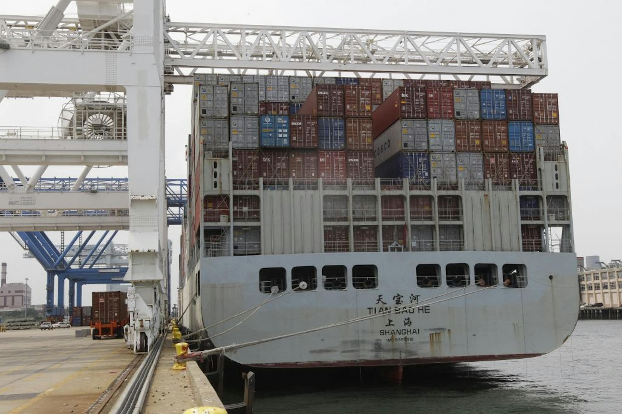 In this Friday, July 13, 2012, photo, a container ship from China is docked at Massport's Conley Terminal in the port of Boston. The U.S. trade deficit widened in August 2012 as exports fell to the lowest level in six months, a worrisome sign that a slowing global economy is cutting into demand for U.S. goods
