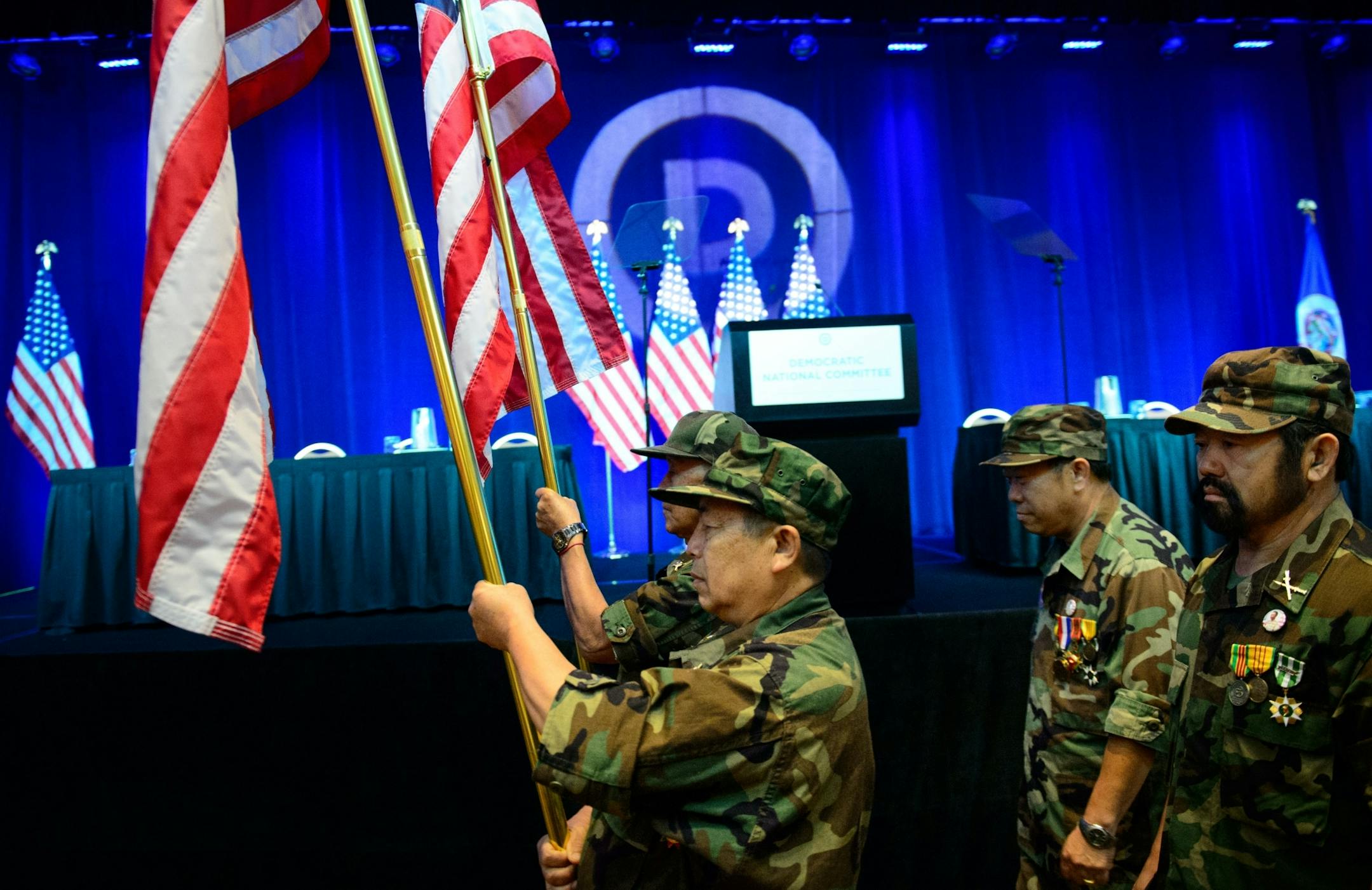Members of the United States Secret Army Special Guerrilla Unit Vietnam War Lao/Hmong Veterans from St. Paul prepared to carry the colors at the DNC meeting.
