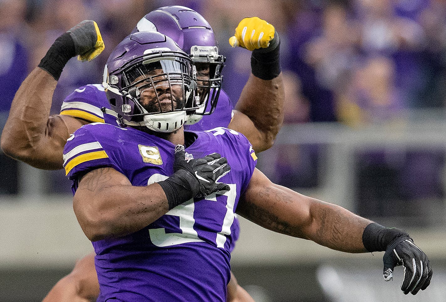 Vikings defensive ends Everson Griffen (97) and Danielle Hunter celebrated a sack in the third quarter against the Lions.