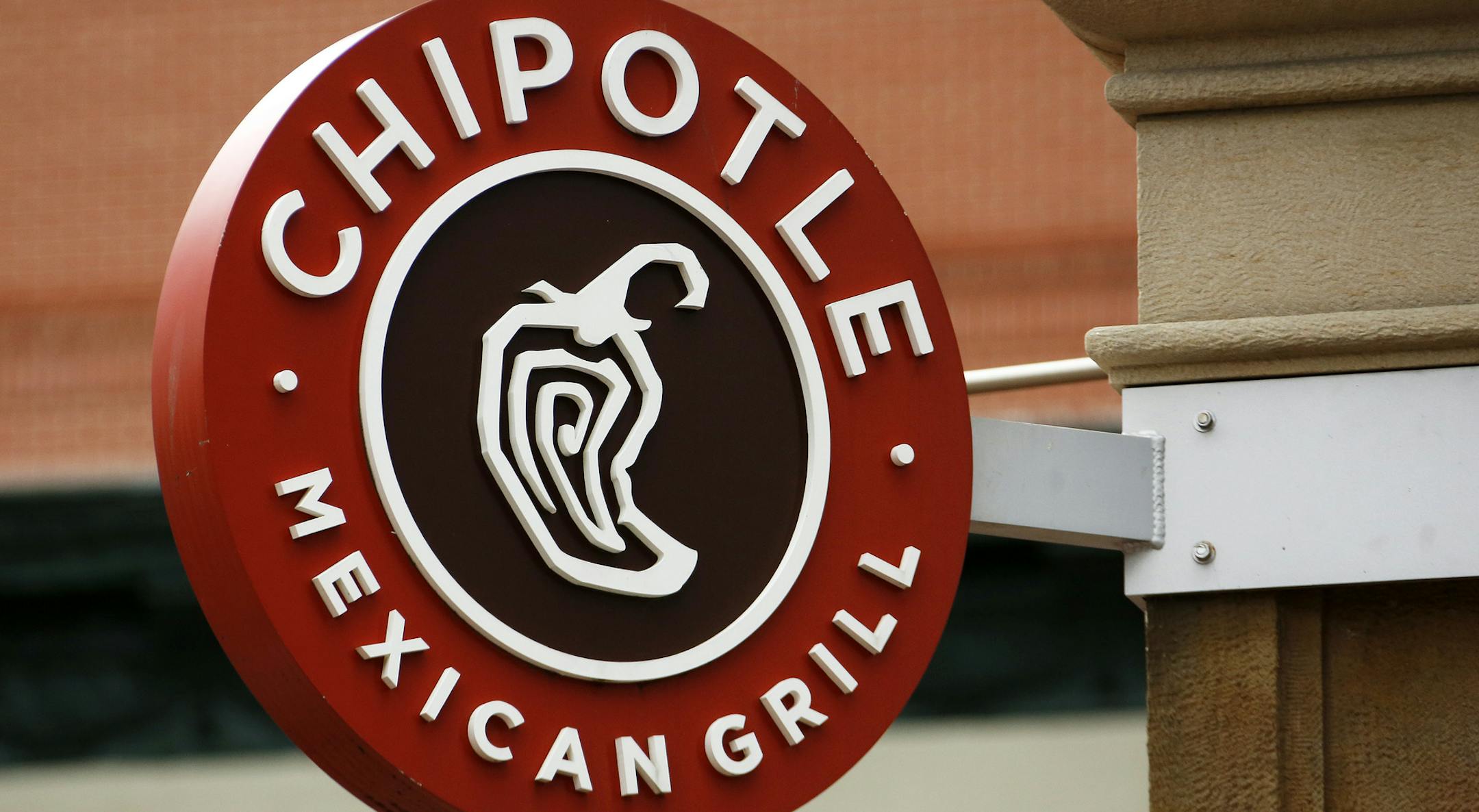This Thursday, Jan. 12, 2017, photo shows the sign on a Chipotle restaurant in Pittsburgh. Chipotle Mexican Grill Inc. reports financial results, Tuesday, April 25, 2017. (AP Photo/Gene J. Puskar)