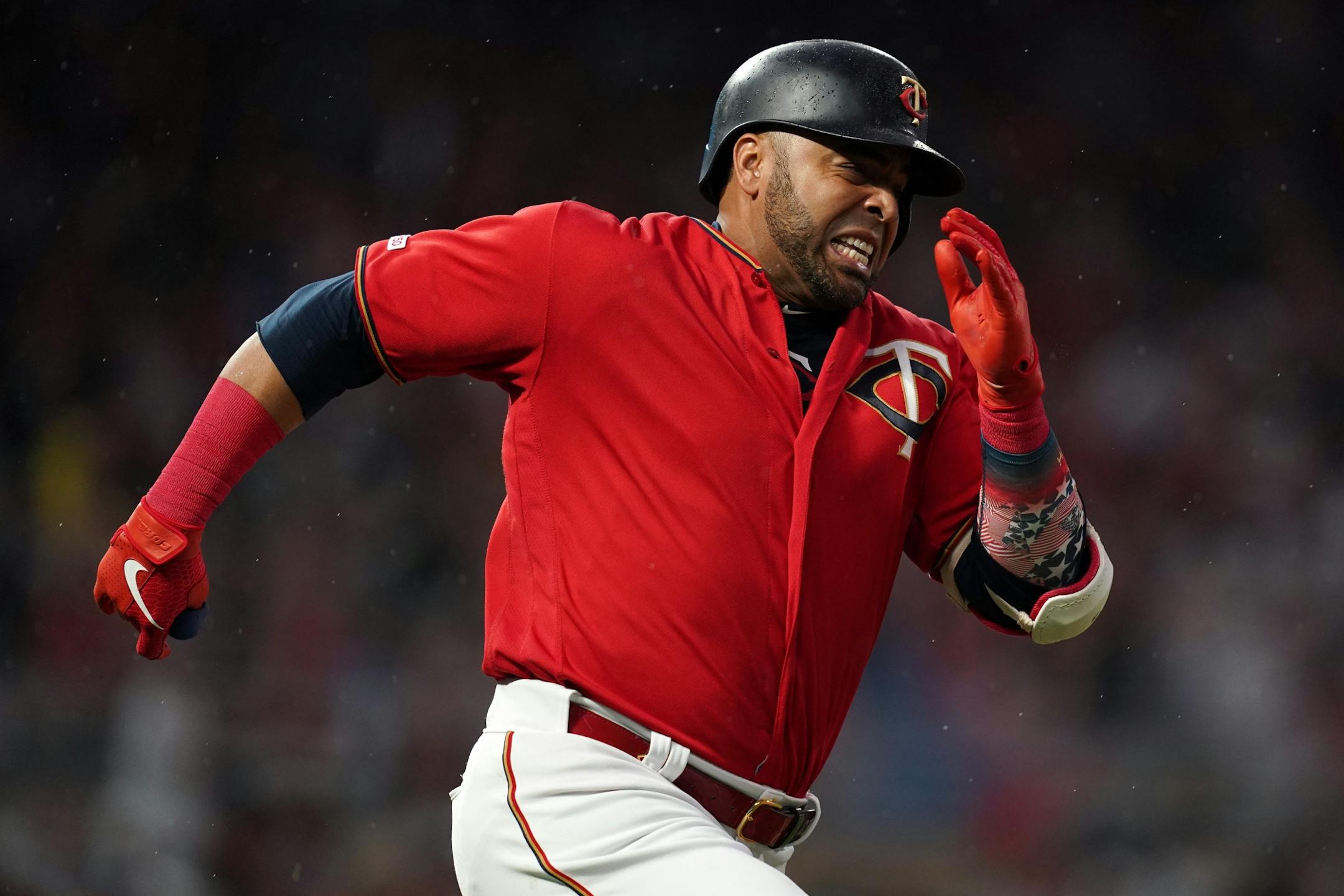 Minnesota Twins designated hitter Nelson Cruz (23) raced down the first base line after he hit a double in the second inning.