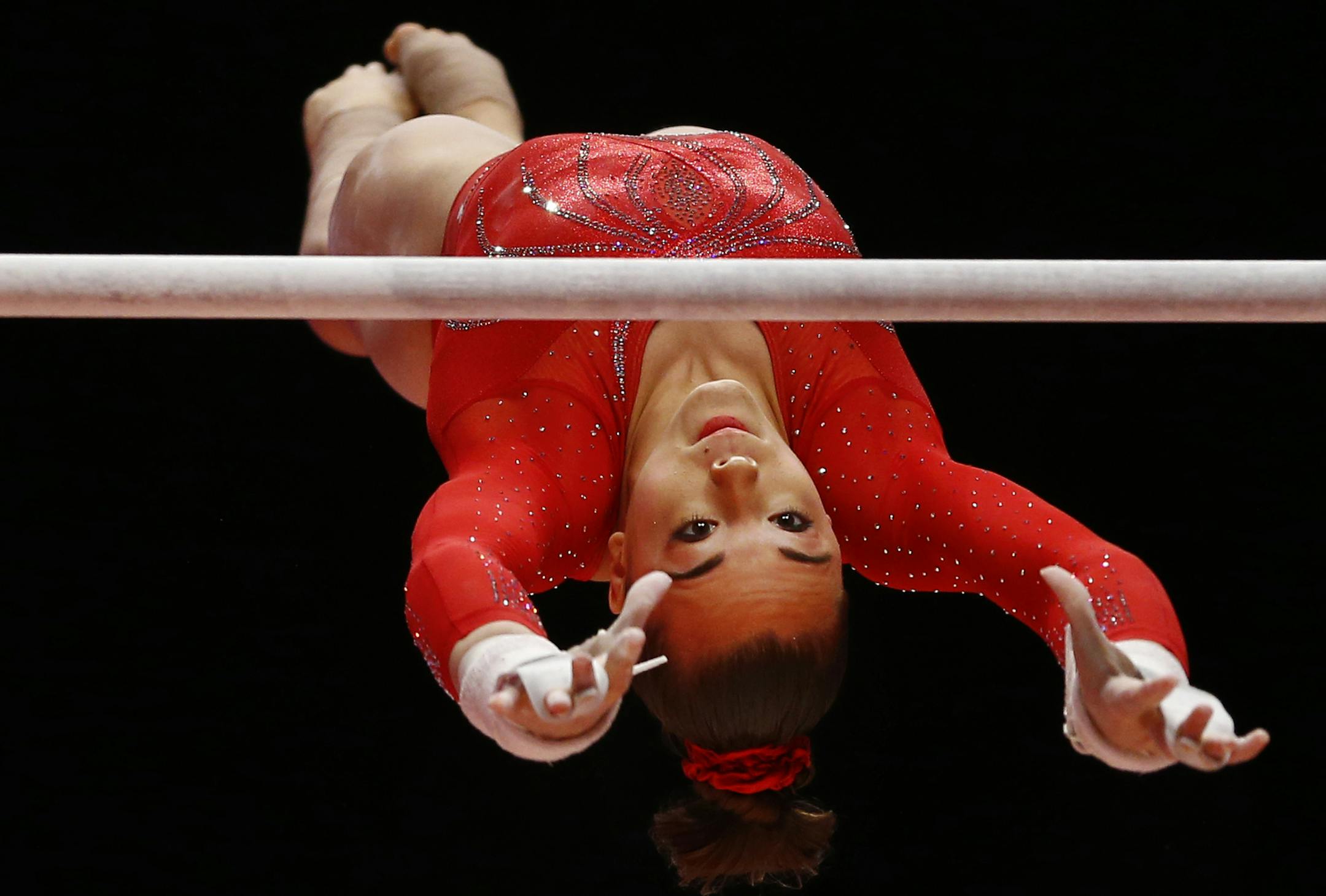 Maggie Nichols of the U.S. performs on the uneven bars during the women's team final competition at the World Artistic Gymnastics championships at the SSE Hydro Arena in Glasgow, Scotland, Tuesday, Oct. 27, 2015. (AP Photo/Matthias Schrader)