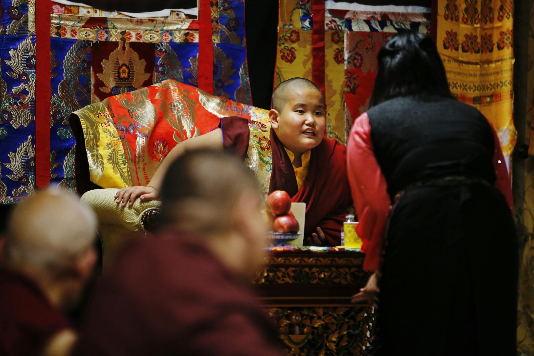 Jalue Dorjee,9, presided over a religious ceremony at the Tibetan American Foundation in St. Paul where he was the guest of honor.