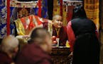 Jalue Dorjee,9, presided over a religious ceremony at the Tibetan American Foundation in St. Paul where he was the guest of honor.