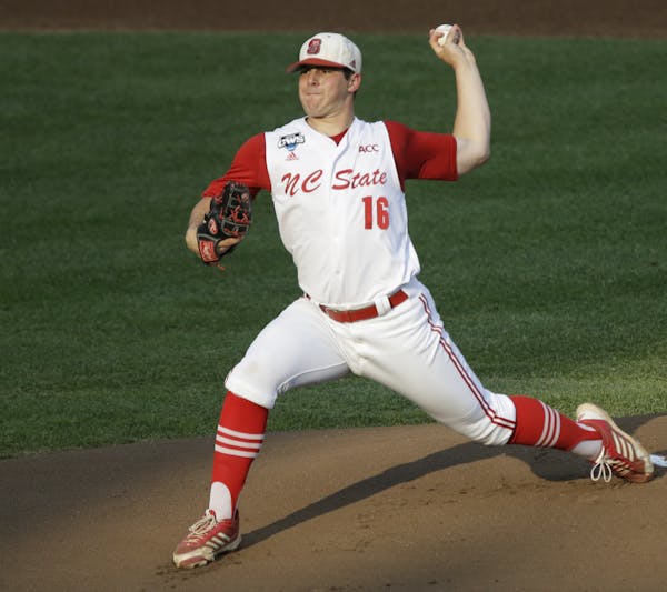 FILE - In this June 20, 2013 file photo, North Carolina State pitcher Carlos Rodon throws against North Carolina during an NCAA College World Series e