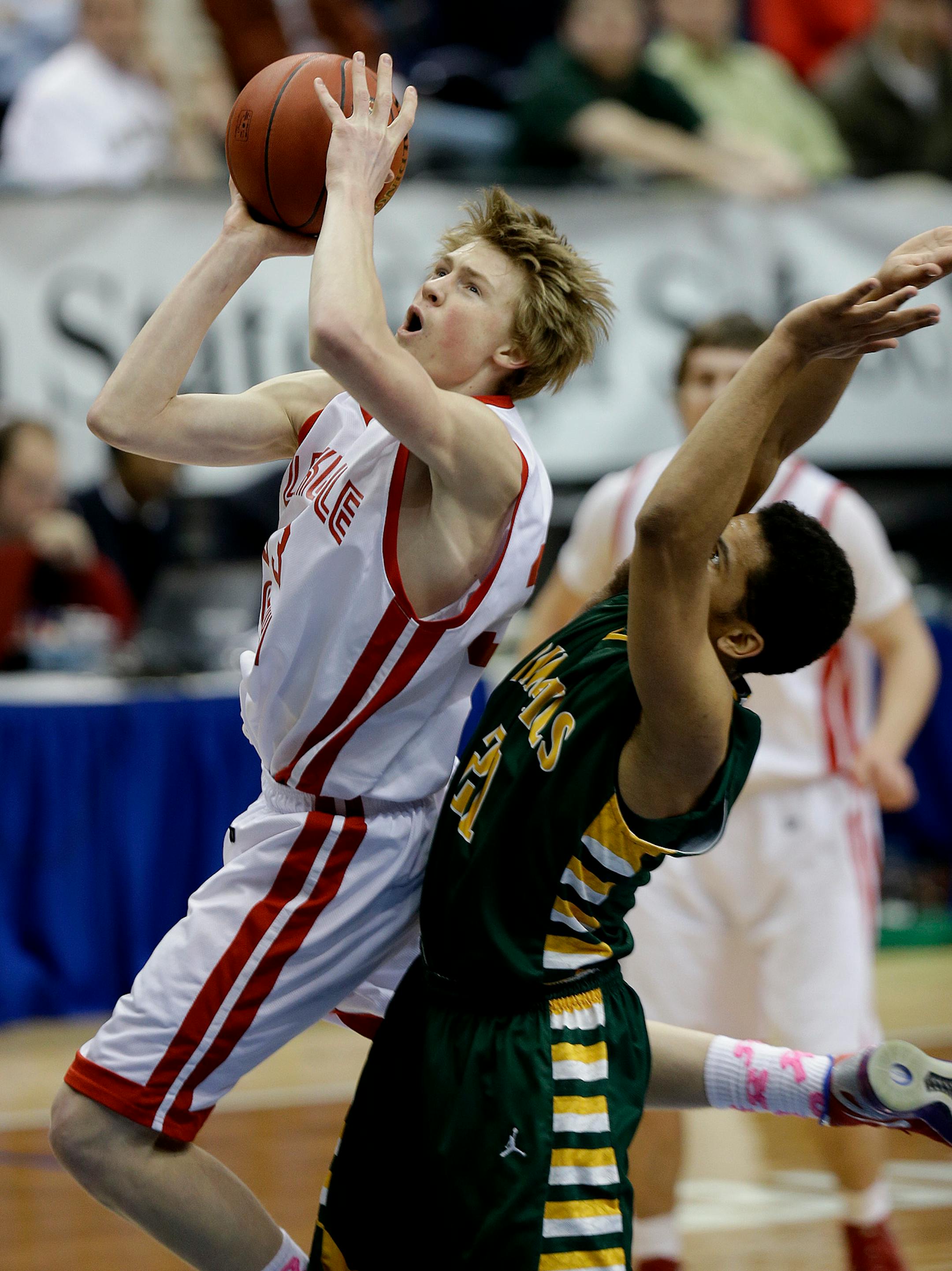 Lakeville North's JP Macura went to the basket taking on Park Center's Quinton Hooker during the state quarterfinals last March. Macura has verbally committed to Xavier.