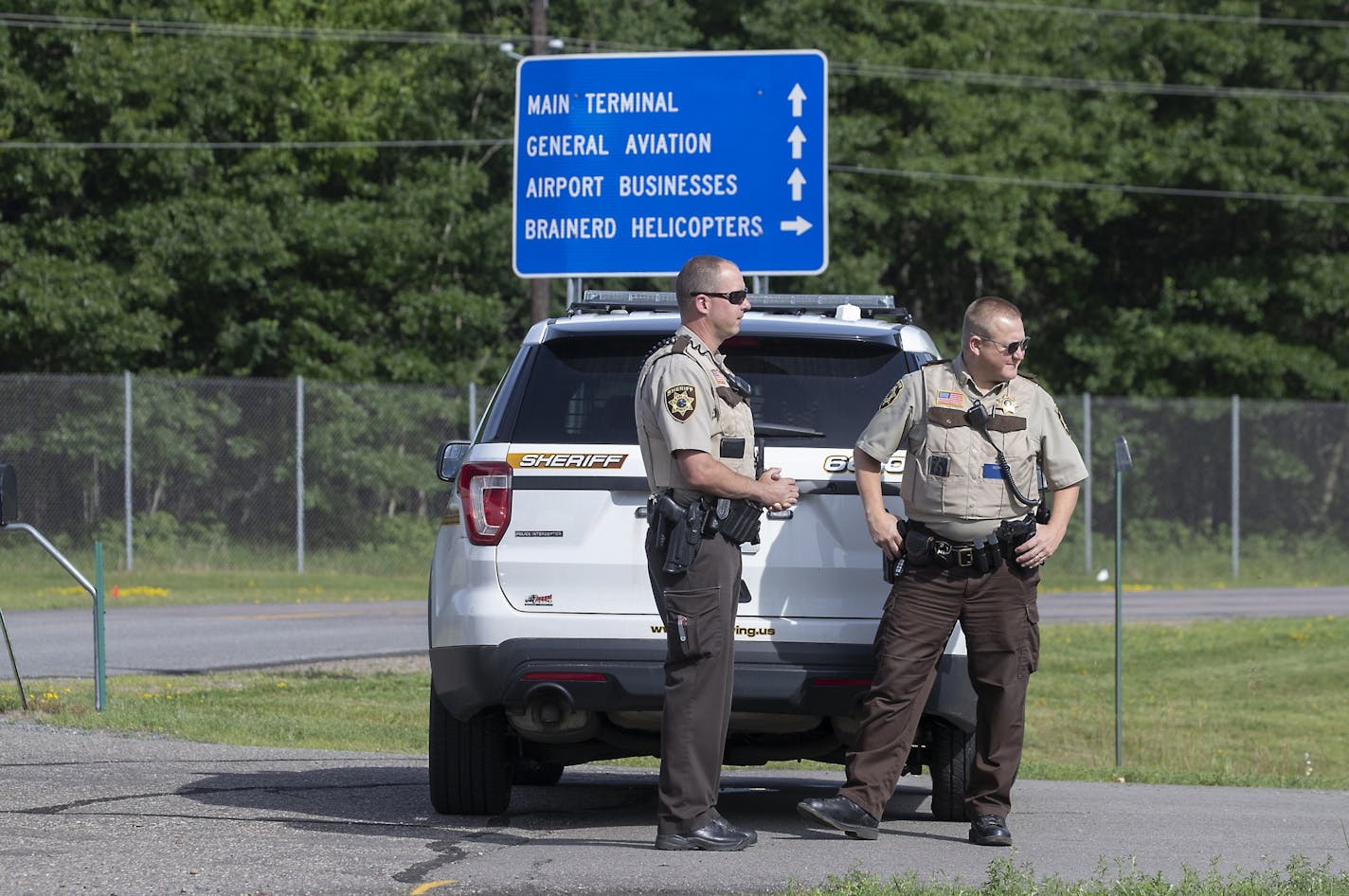 Crow Wing County Sheriff's officers stood alongside the Brainerd Lakes Regional Airport, near the site where a North Memorial Health helicopter crashed where the pilot and the nurse died at the scene, Friday, June 28, 2019 in Brainerd, MN.