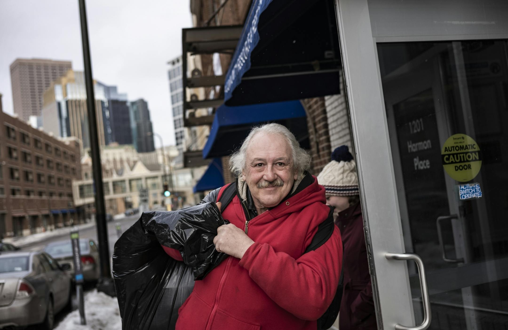 Leaving the Minneapolis VA Community Resource and Referral Center, Robert Kleen is all smiles as he is about to move in his first permanent housing since 2015.