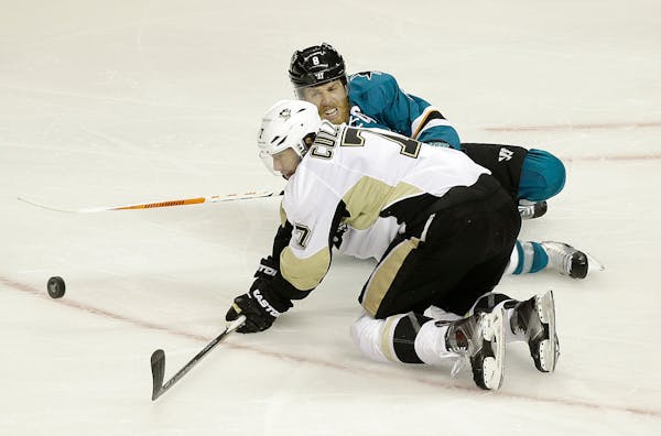 Veteran center Matt Cullen, front, and the Penguins have helped hold the Sharks&#x2019; Joe Pavelski, rear, in check. Pavelski had 13 goals in the fir