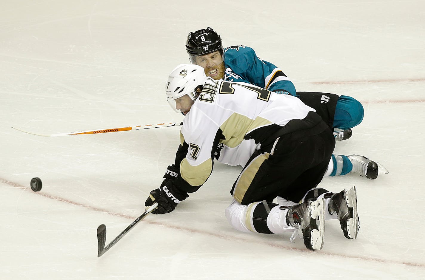 Veteran center Matt Cullen, front, and the Penguins have helped hold the Sharks&#x2019; Joe Pavelski, rear, in check. Pavelski had 13 goals in the first three rounds but is pointless in the Stanley Cup Final.