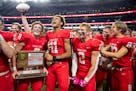 Mankato West players celebrate after defeating Mahtomedi 24-10 in the Class 5A Prep Bowl