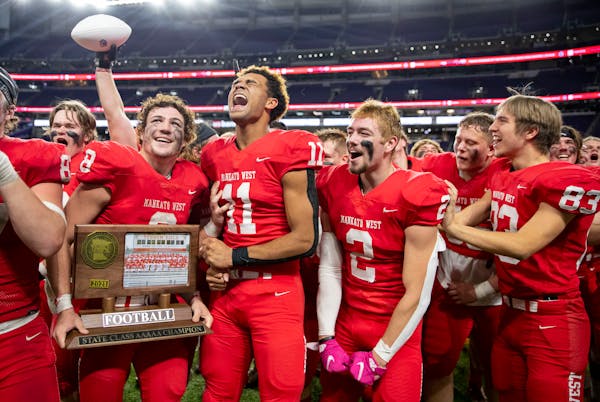 Mankato West players celebrate after defeating Mahtomedi 24-10 in the Class 5A Prep Bowl