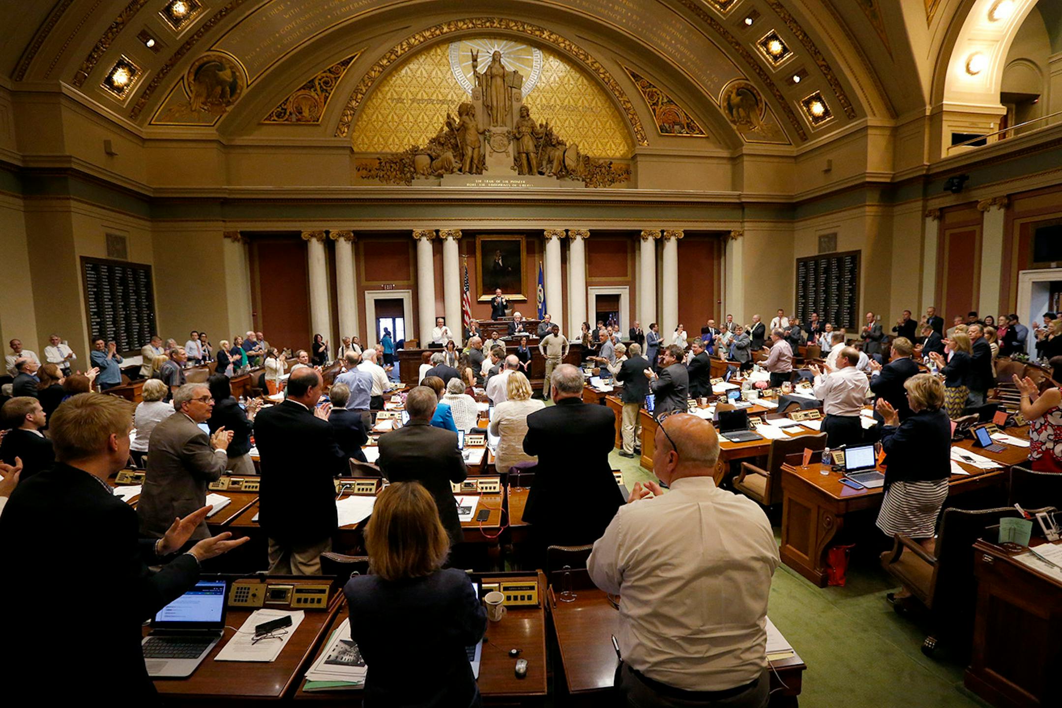 Member of the house stood an applauded during recognition of veterans.