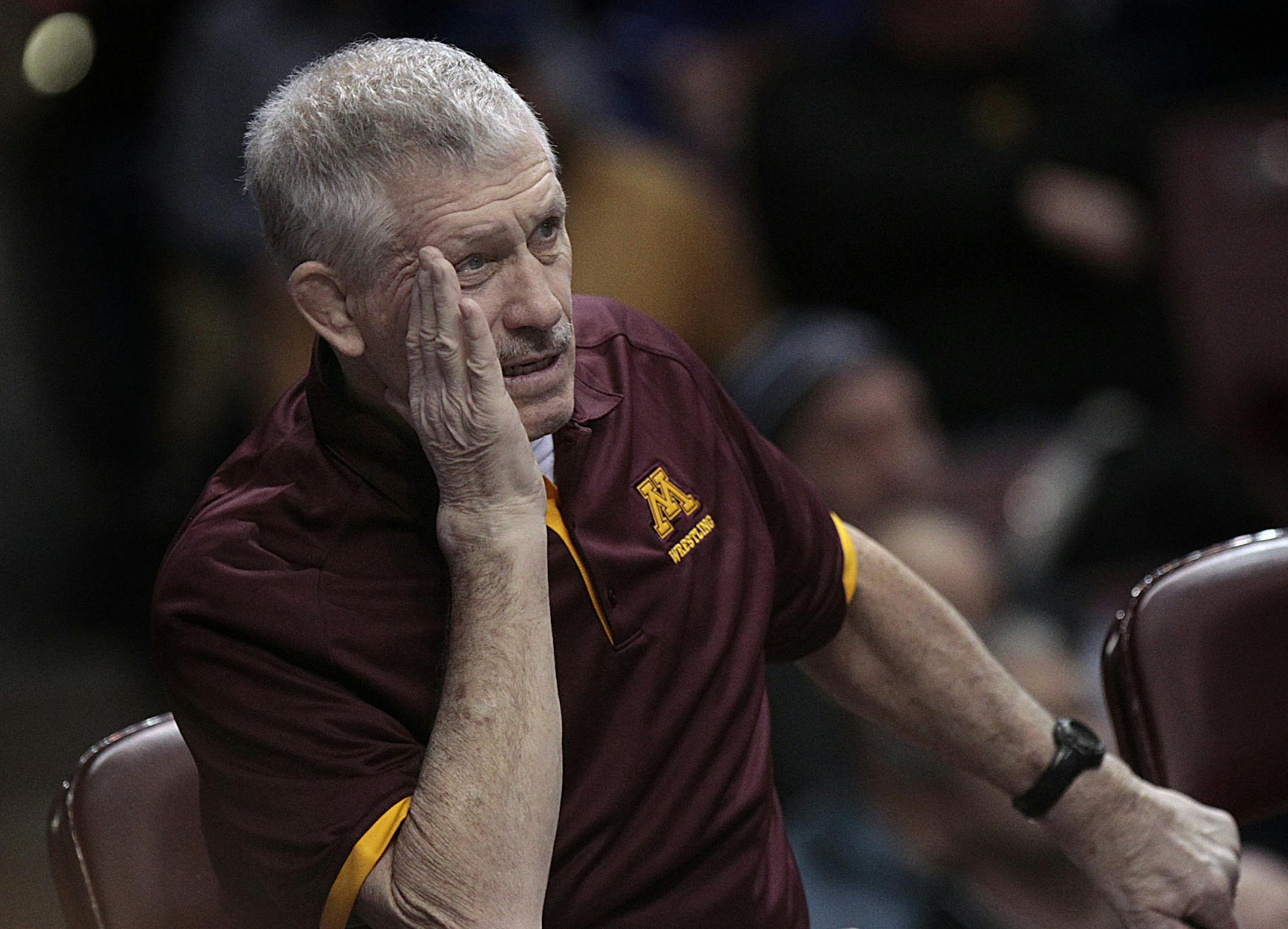 Minnesota head wrestling coach J Robinson concentrated in the early going of the match against Iowa. ] JIM GEHRZïjgehrz@startribune.com (JIM GEHRZ/STAR TRIBUNE) / February 23, 2012 / 1:00 PM Minneapolis, MN ñ BACKGROUND INFORMATION: The University of Minnesota wrestling team faced Iowa in the semifinals of National Duals, an event that the Gophers are hosting. Minnesota won the match 22-15 to advance to the finals against Oklahoma State. ORG XMIT: MIN1302231650301167 ORG XMIT: MIN16052