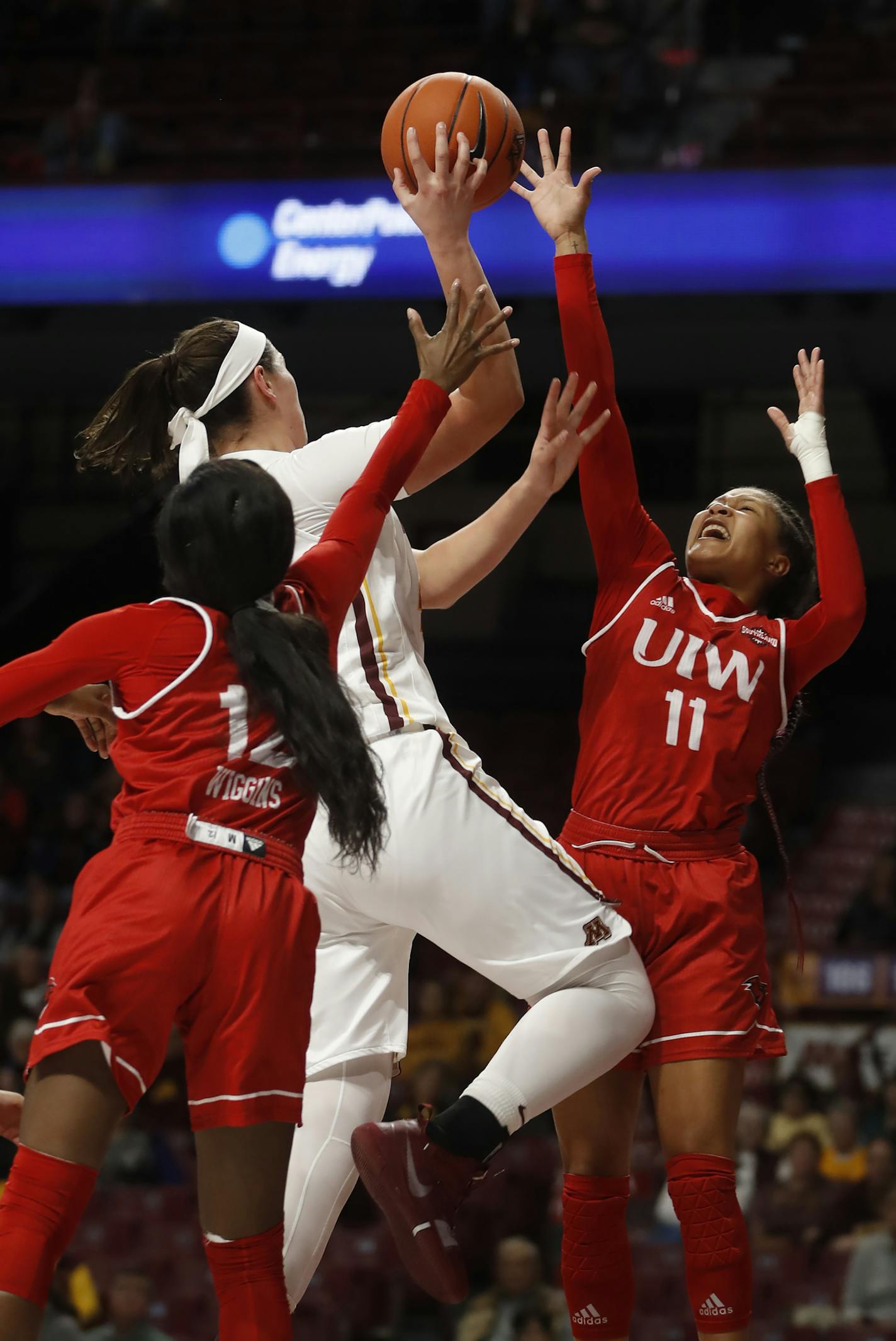 Imani Robinson(11) defends against Annalese Lamke(41) of the Gophers .]Gophers vs. Incarnate Word at Williams Arena.Richard Tsong-Taatarii/Richard&#x2022;Tsong-Taatarii@startribune.com