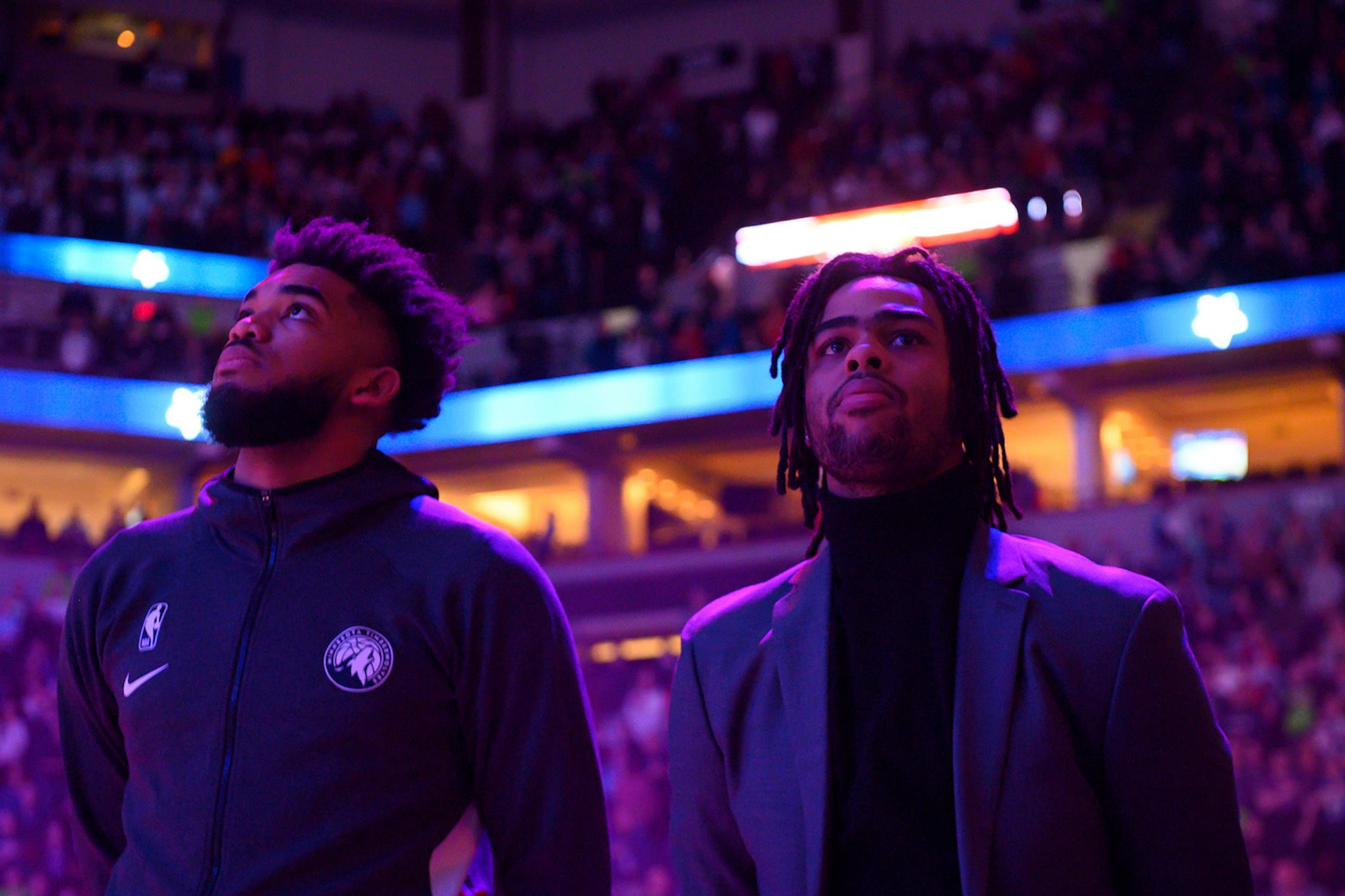 Minnesota Timberwolves center Karl-Anthony Towns (32) stood beside guard D'Angelo Russell (0) for the national anthem.