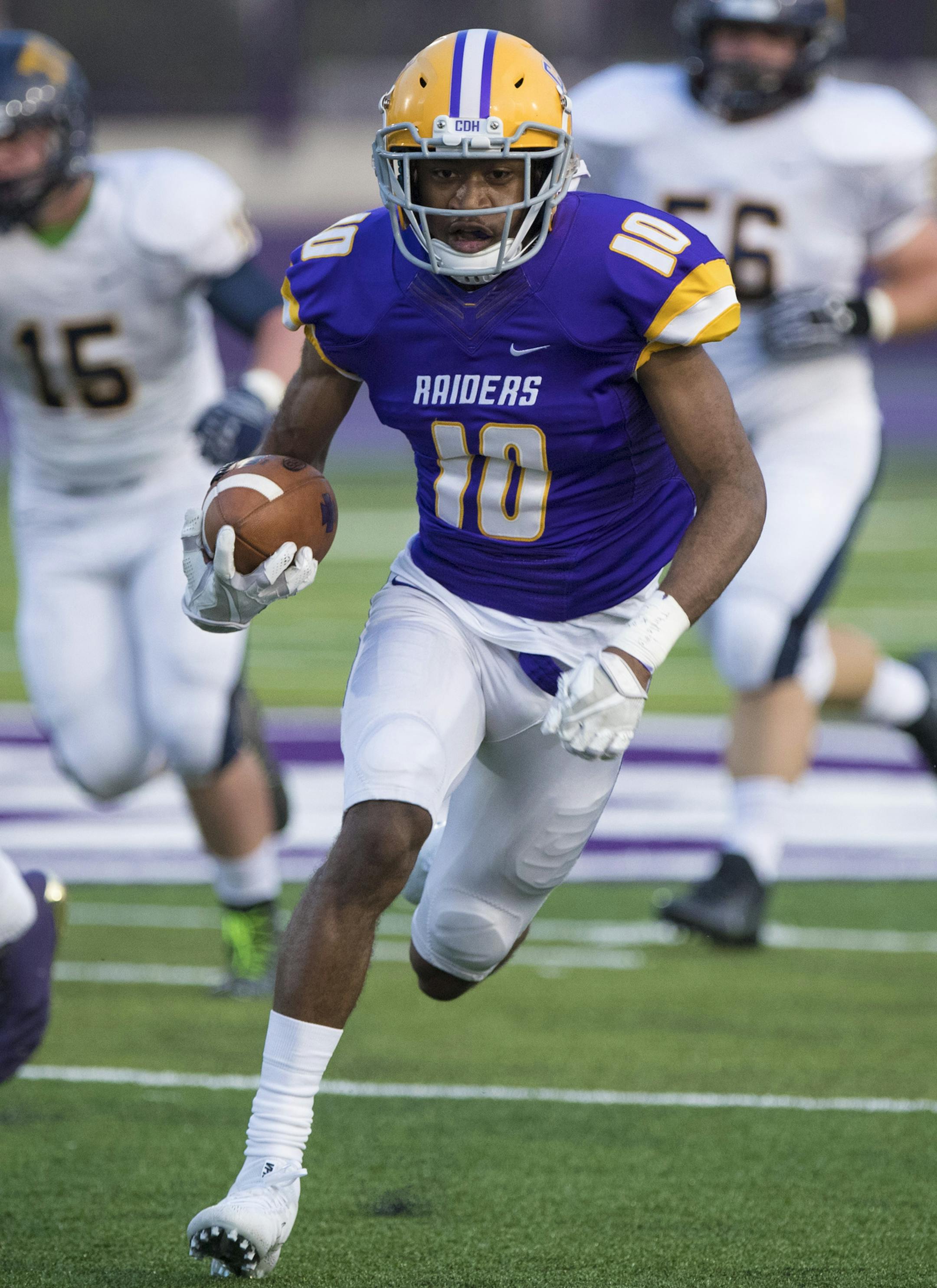 Jaylen Newton (10) ran for a first down during the first half of a Totino-Grace verse Cretin-Derham Hall football game at O'Shaughnessy Stadium at the University of St. Thomas on Thursday, August 31, 2017, in St. Paul, Minn. ] RENEE JONES SCHNEIDER • renee.jones@startribune.com
