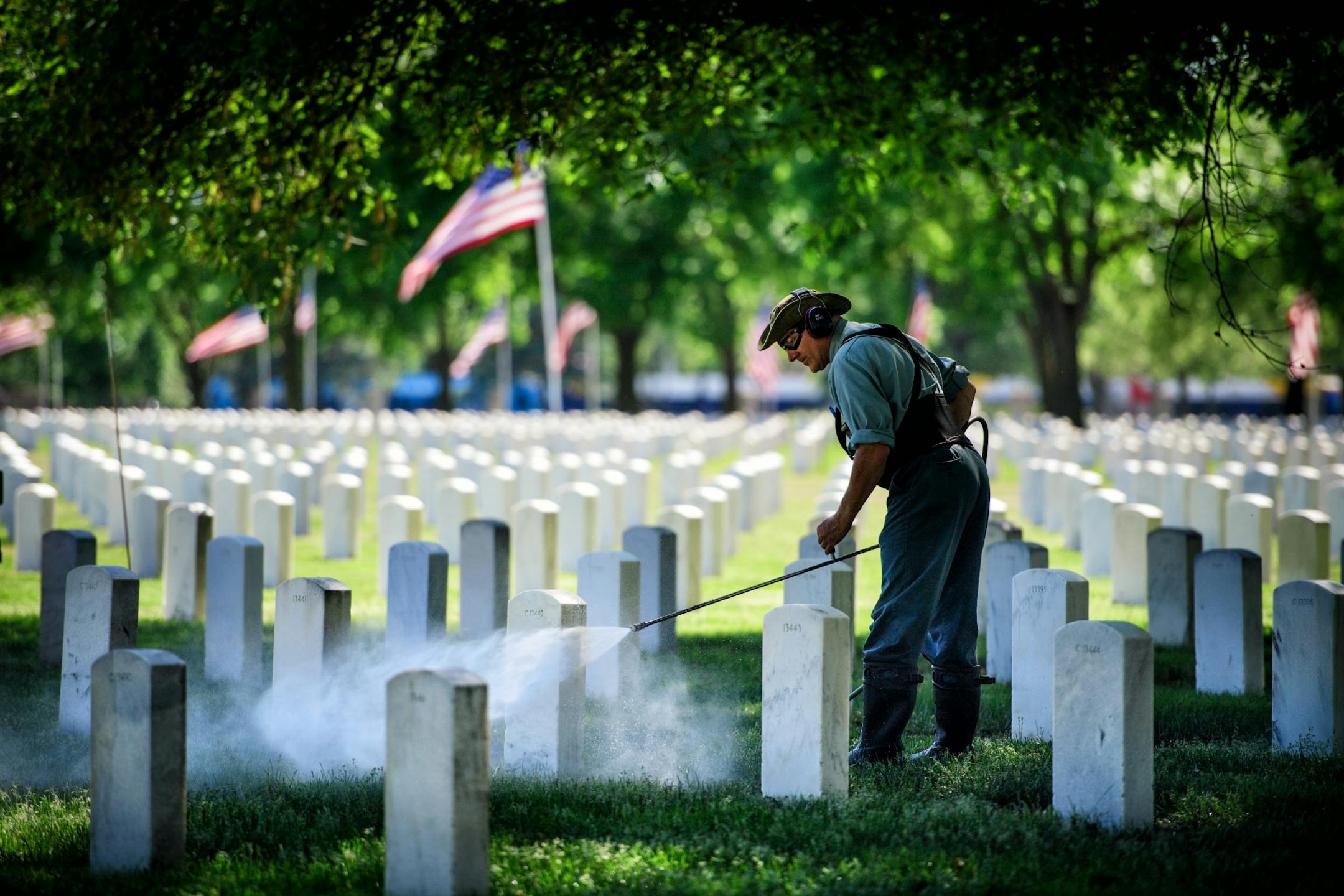 Power washing gravestones is a full time job for Mark Linafelter at Fort Snelling National Cemetery. He averages around 250 per day and around Memorial Day he focuses his attention to the ones under trees that need it the most to keep the place looking good for visitors.