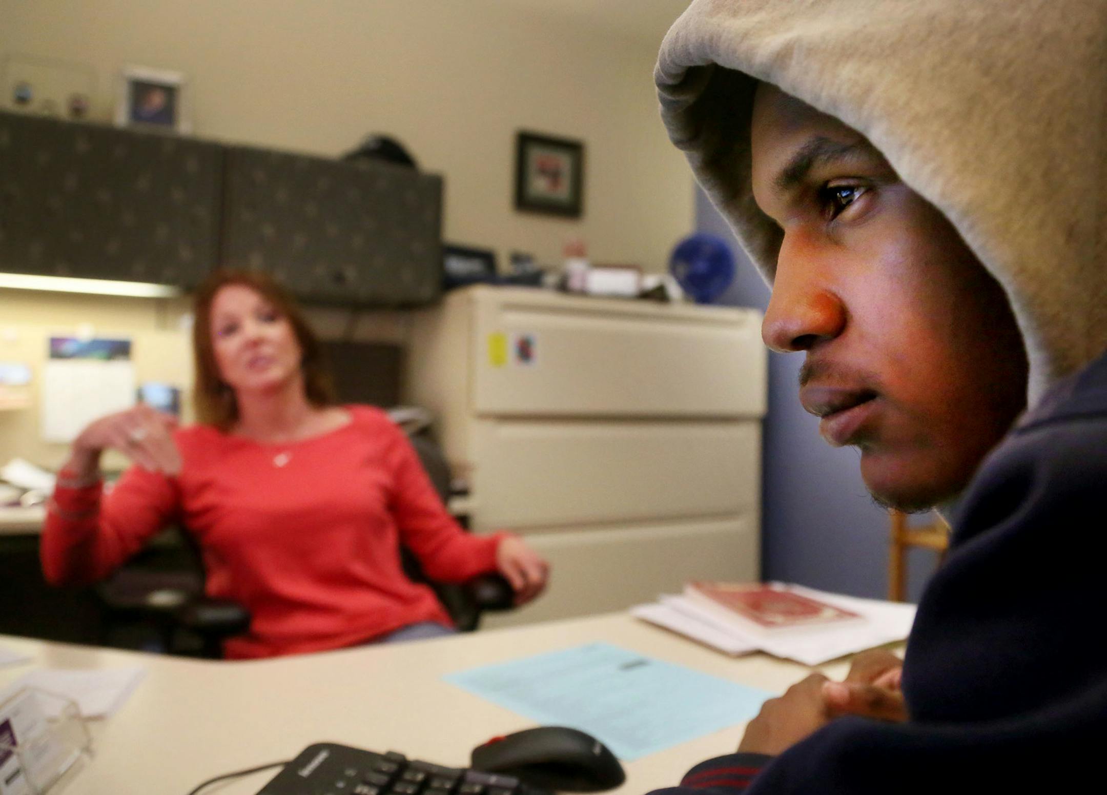 More than a third of students at Minneapolis Community Technical College go for free, mostly through a program called the Power of You. Here, Keith Washington, 18, a Fair School downtown grad and an MCTC student in the Power of You program, right, looks at a computer screen showing classes and grades while talking with Jody Fisher, student support coordinator for the Power of You Program, about his studies and plans going forward Thursday, Jan. 22, 2015, in Minneapolis, MN. Washington moved to M