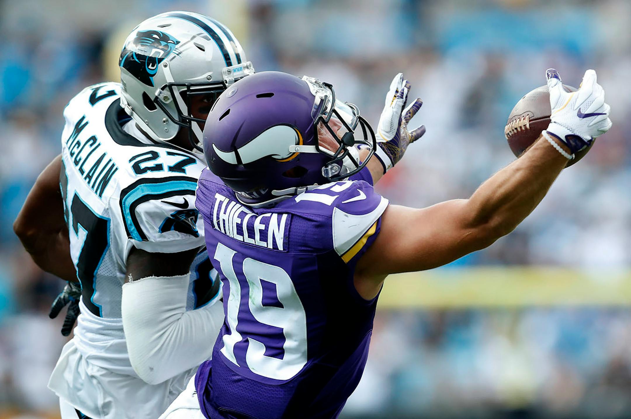 Adam Thielen (19) caught a 19-yard pass while being defended by Robert McClain (27) in the fourth quarter.