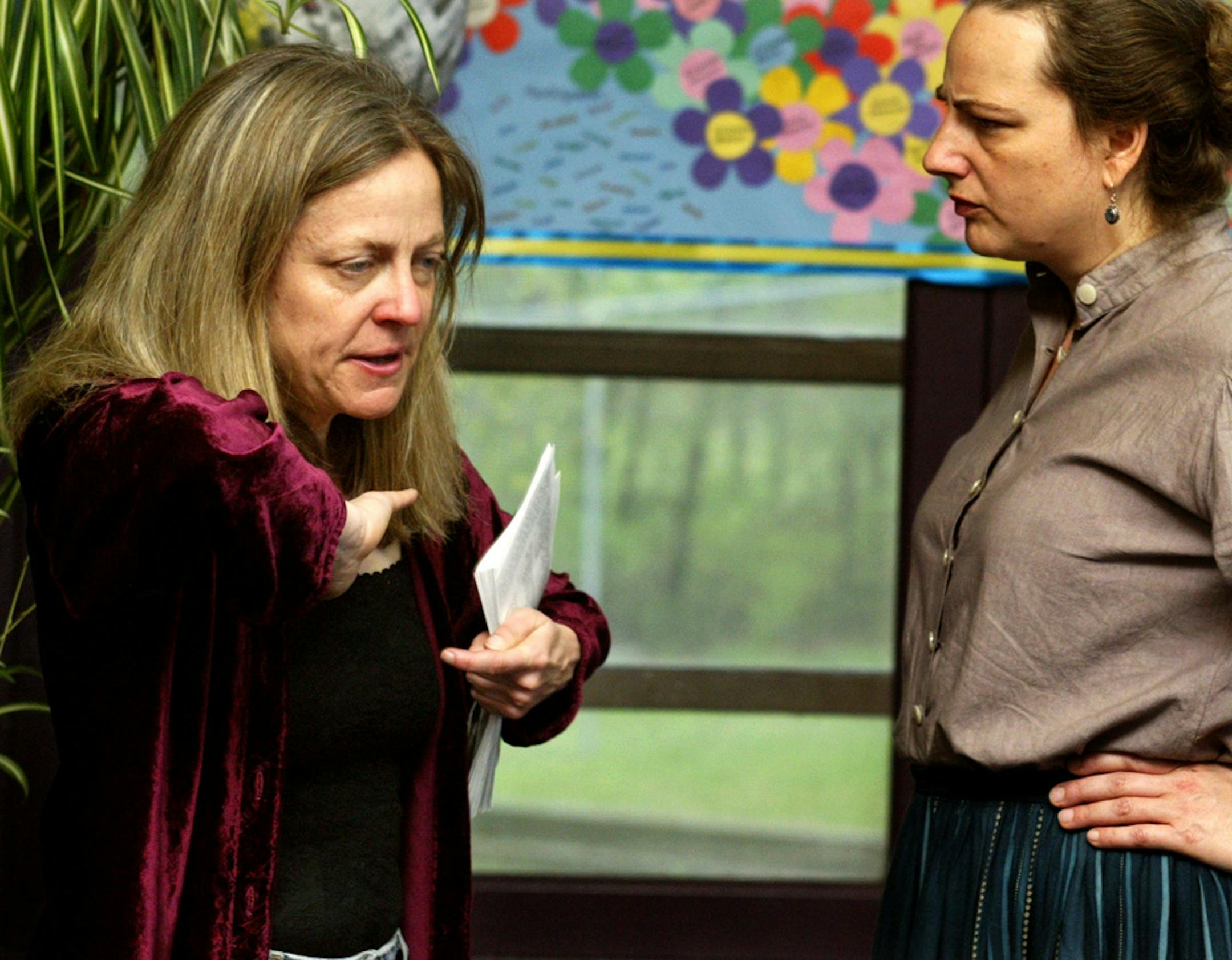 Michelle Hensely, left, gives direction to actor Carolyn Goelzer during a rehearsal.