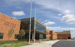 A staff member at East Ridge High School in Woodbury was removed Thursday after students reported that the staff member used a racial slur.