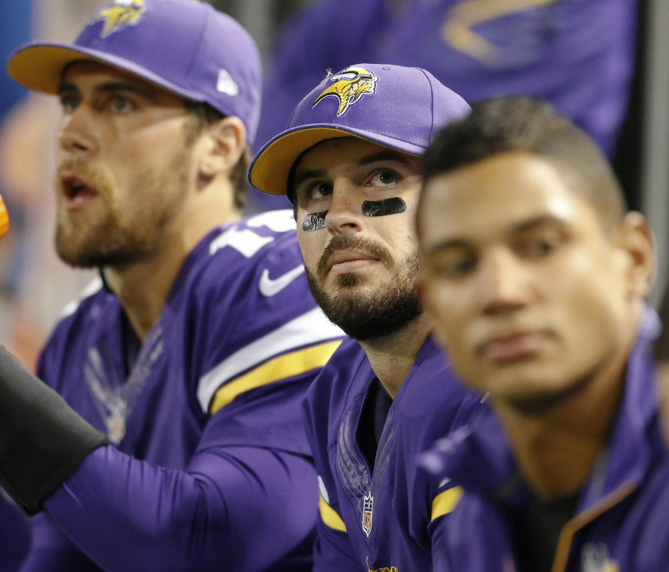 Minnesota Vikings quarterback Christian Ponder (center) sat with quarterback Matt Cassel,m left, and injured quarterback Josh Freeman as they watched the Vikings lose in the fourth quarter.