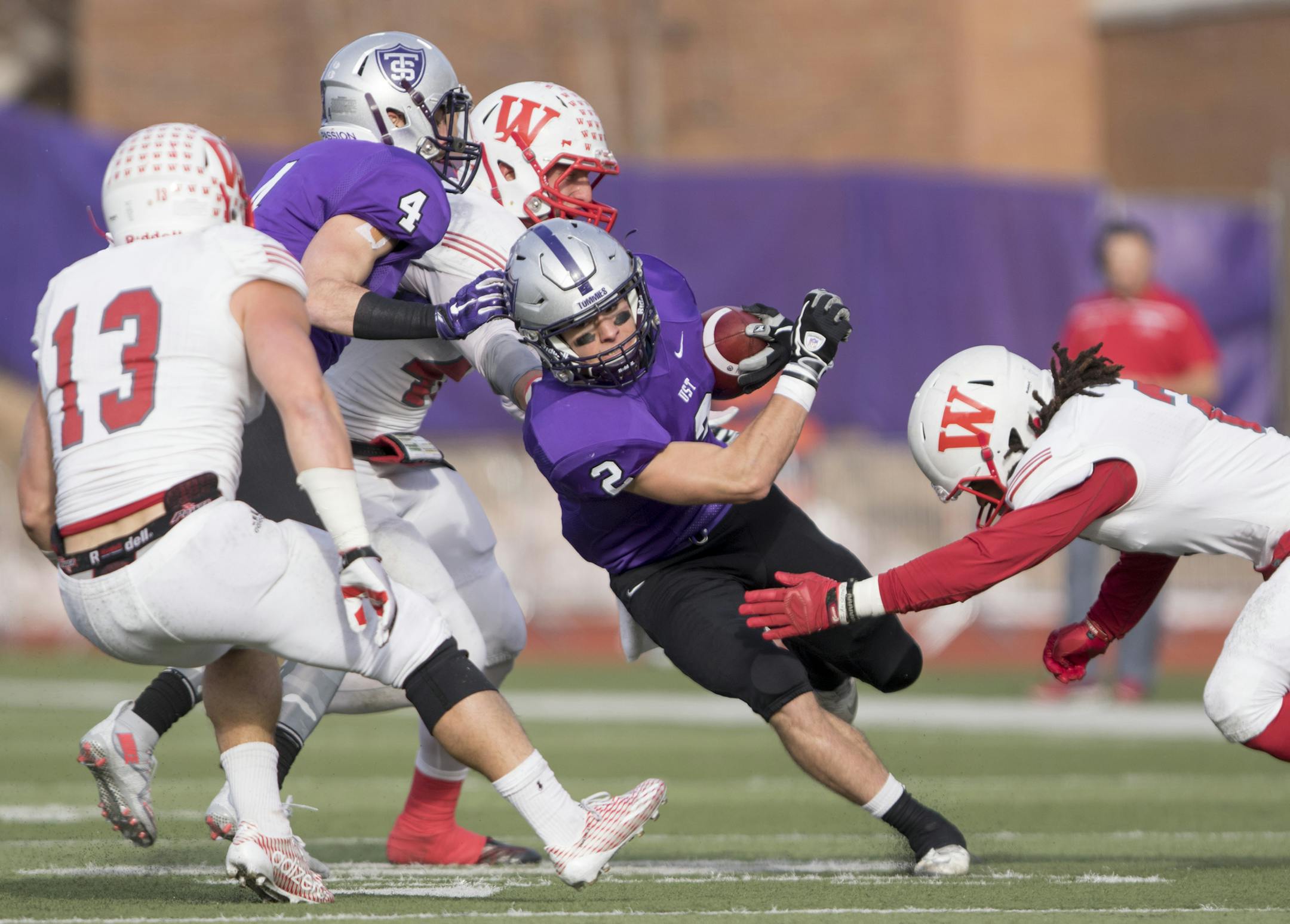 St. Thomas receiver Nick Waldvogel (2) splits the defenders as the University of St. Thomas Tommies hosted the Wabash College Little Giants on December 5, 2015. ] Special to Star Tribune MATT BLEWETT &#xef; matt@mattebphoto.com - December 5, 2015, St. Paul, MN, University of St. Thomas Tommies, Wabash Little Giants, NCAA Division III Football quarterfinals, University of St. Thomas Tommies vs. Wabash Little Giants, 977590 120515