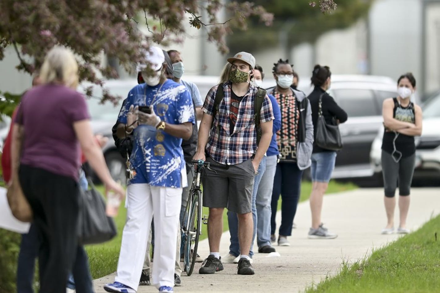 People lined up outside the National Guard armory in Minneapolis for free COVID-19 testing Saturday afternoon.