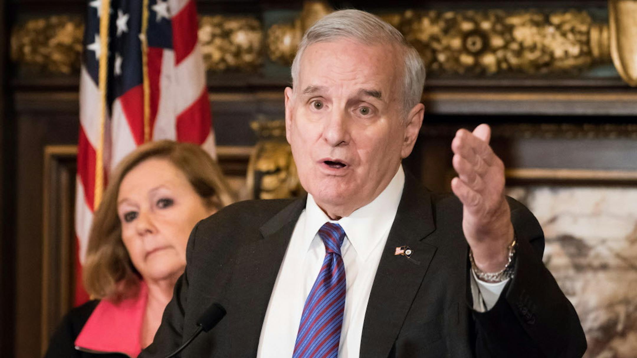 Gov. Mark Dayton on Wednesday proposed $21 million in new funding for security enhancements and mental health improvements in Minnesota schools. Behind him is Karen Orcutt, Superintendent of Orono Schools. ] GLEN STUBBE • glen.stubbe@startribune.com Wednesday, March 7, 2018 Gov. Mark Dayton on Wednesday proposed $21 million in new funding for security enhancements and mental health improvements in Minnesota schools.