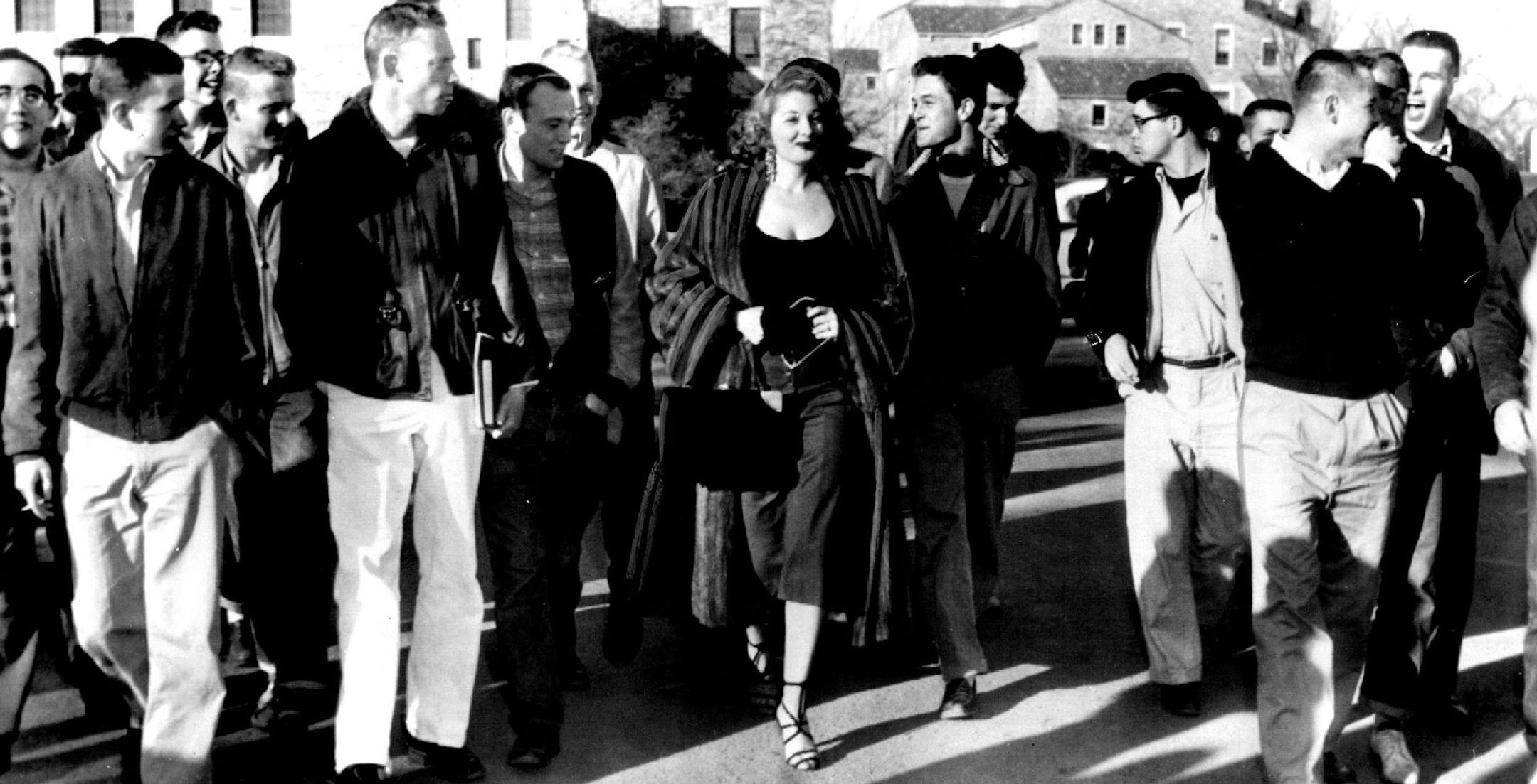 January 29, 1955 Tempest Storm in Academic Teapot at University of Colorado With her are some of the 2,000 male students who clustered about.