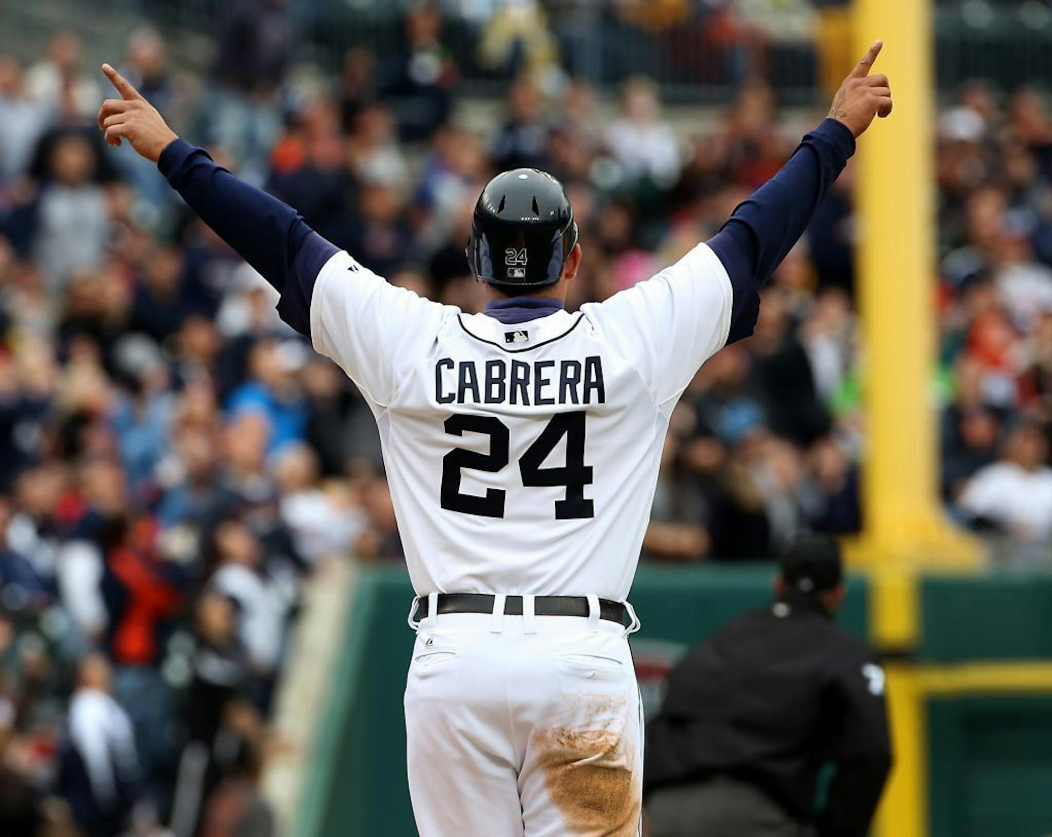 Miguel Cabrera turns on the third base line to watch Delmon Young's three-run home run during third-inning action against the Minnesota Twins.