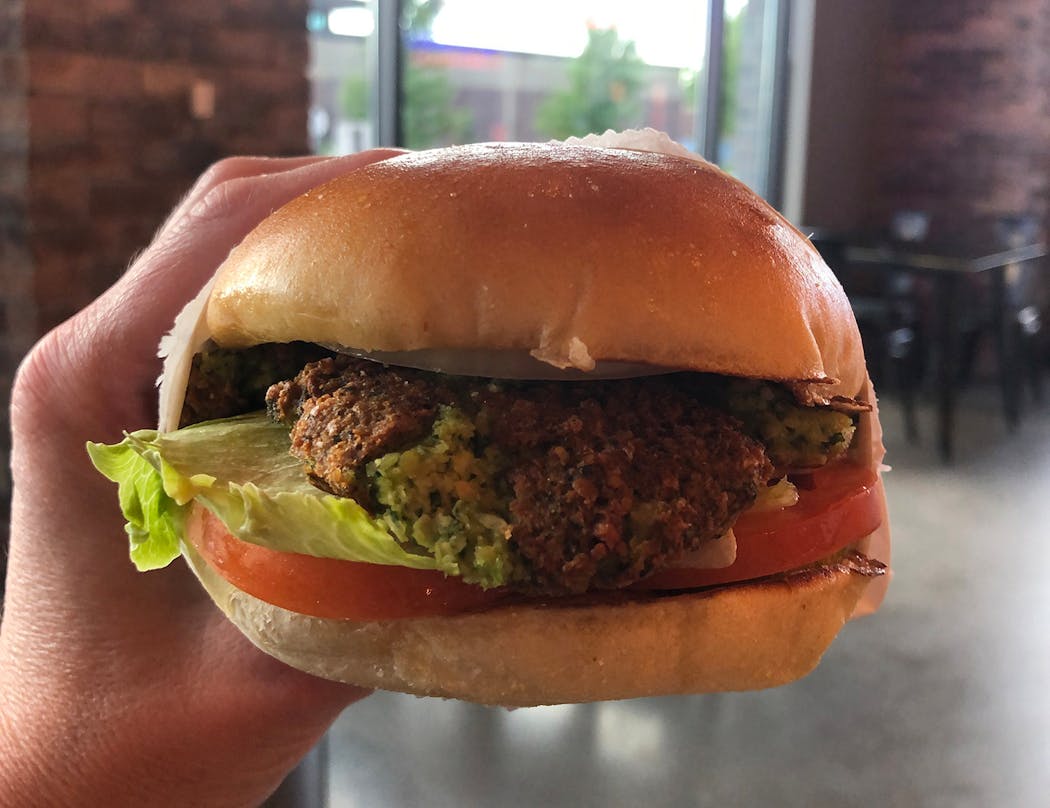 The “Green Burger” at Burger Press is made with a falafel patty.