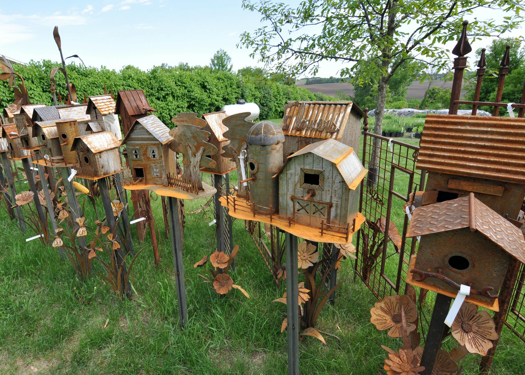 Photo by Liz Rolfsmeier Husband and wife Jody and Kim Reinardy, of Hastings, and Kimís brother, Joe Fliegel, of Cannon Falls, design and create metal garden art.