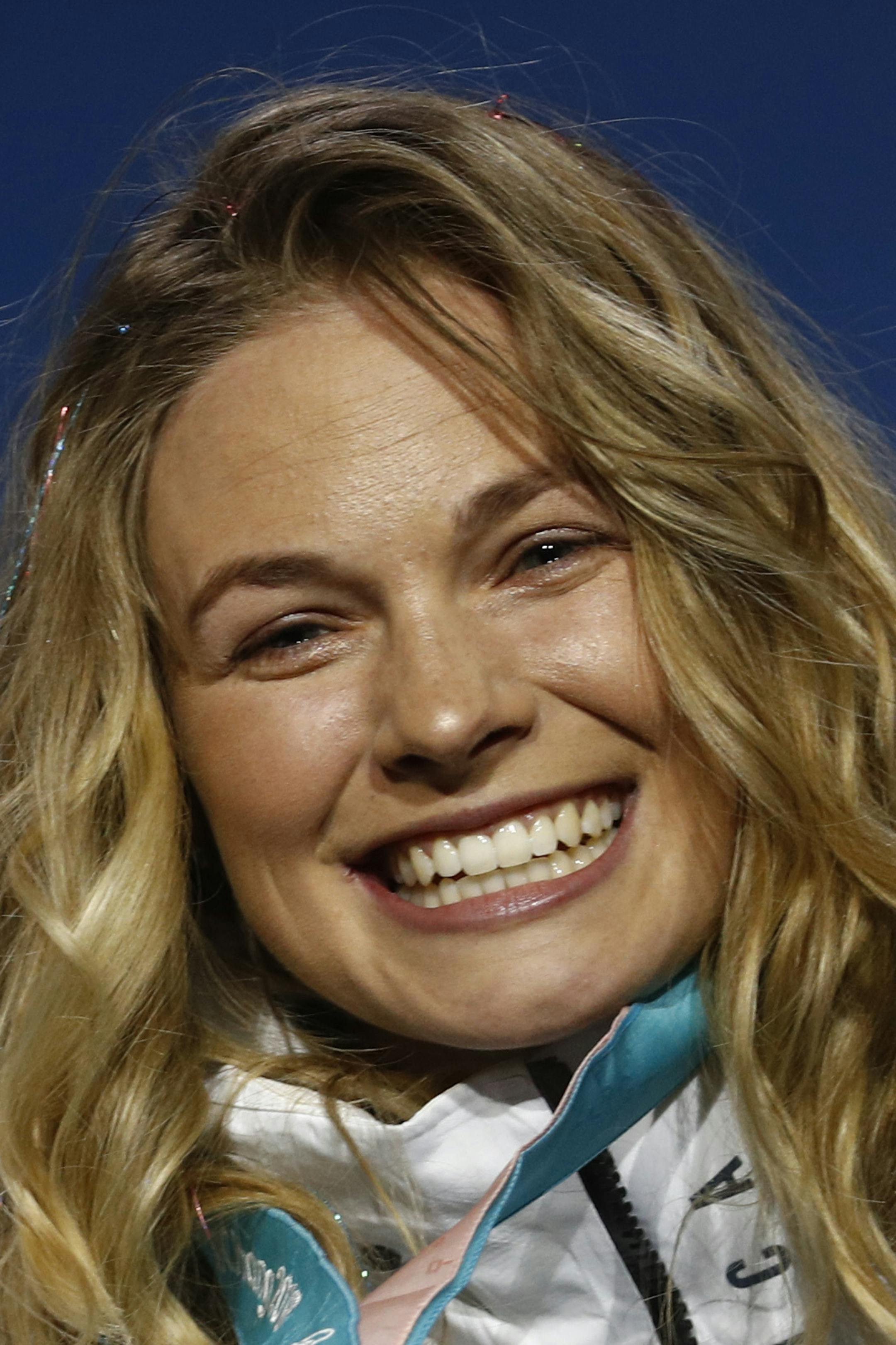 Gold medalists in the women's team sprint freestyle cross-country skiing Kikkan Randall and Jessica Diggins, of the United States, pose during the medals ceremony at the 2018 Winter Olympics in Pyeongchang, South Korea, Thursday, Feb. 22, 2018. (AP Photo/Patrick Semansky)