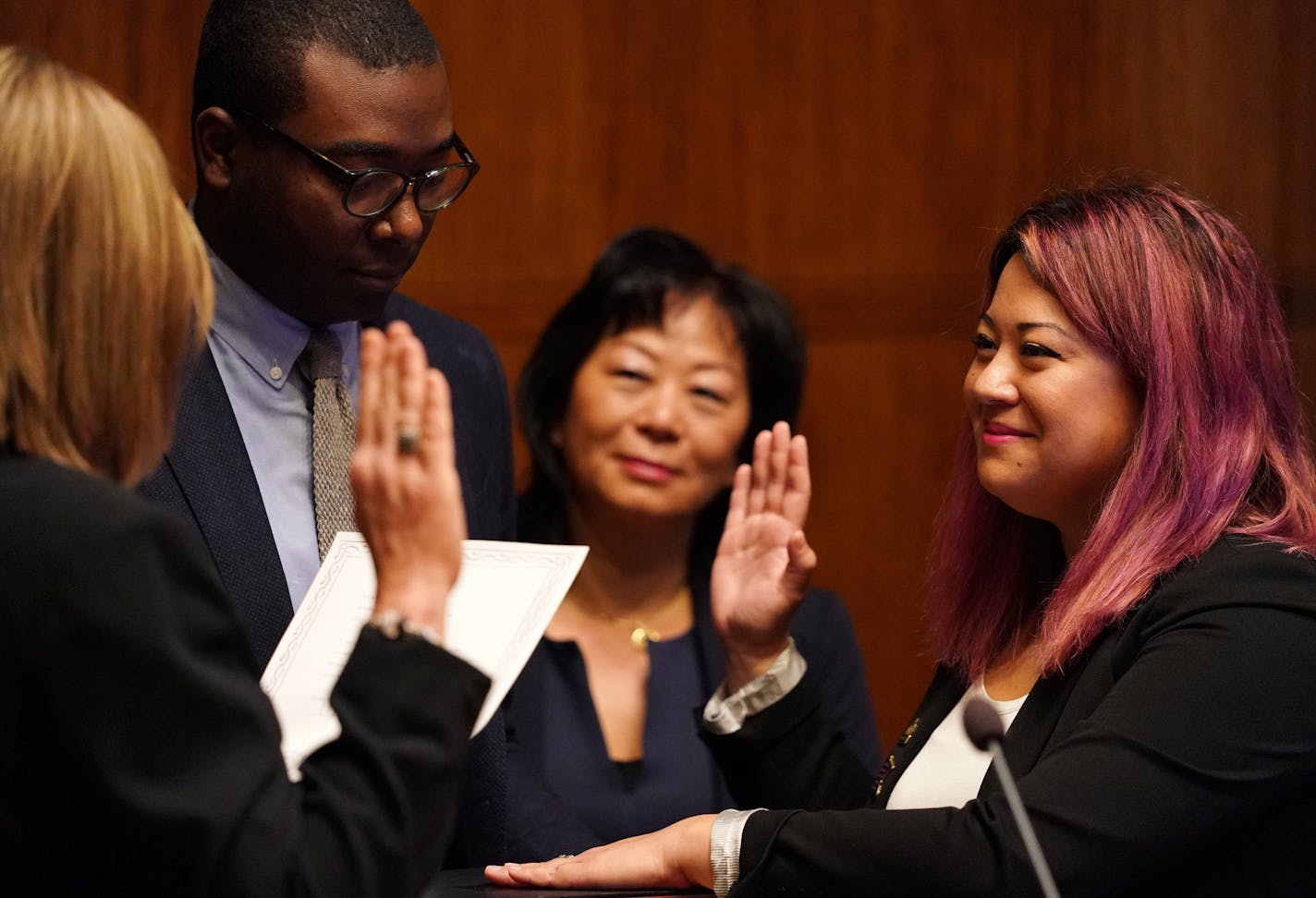 City clerk Shari Moore administered the oath office to new city council member Mitra Jalali Nelson as her campaign manager Garrison McMurtrey and mother Sooki Jalali looked on at St. Paul City Hall. ] ANTHONY SOUFFLE &#xef; anthony.souffle@startribune.com New St. Paul City Council member Mitra Jalali Nelson was sworn in as the new Fourth Ward City Council member Wednesday morning City Hall in St. Paul, Minn.