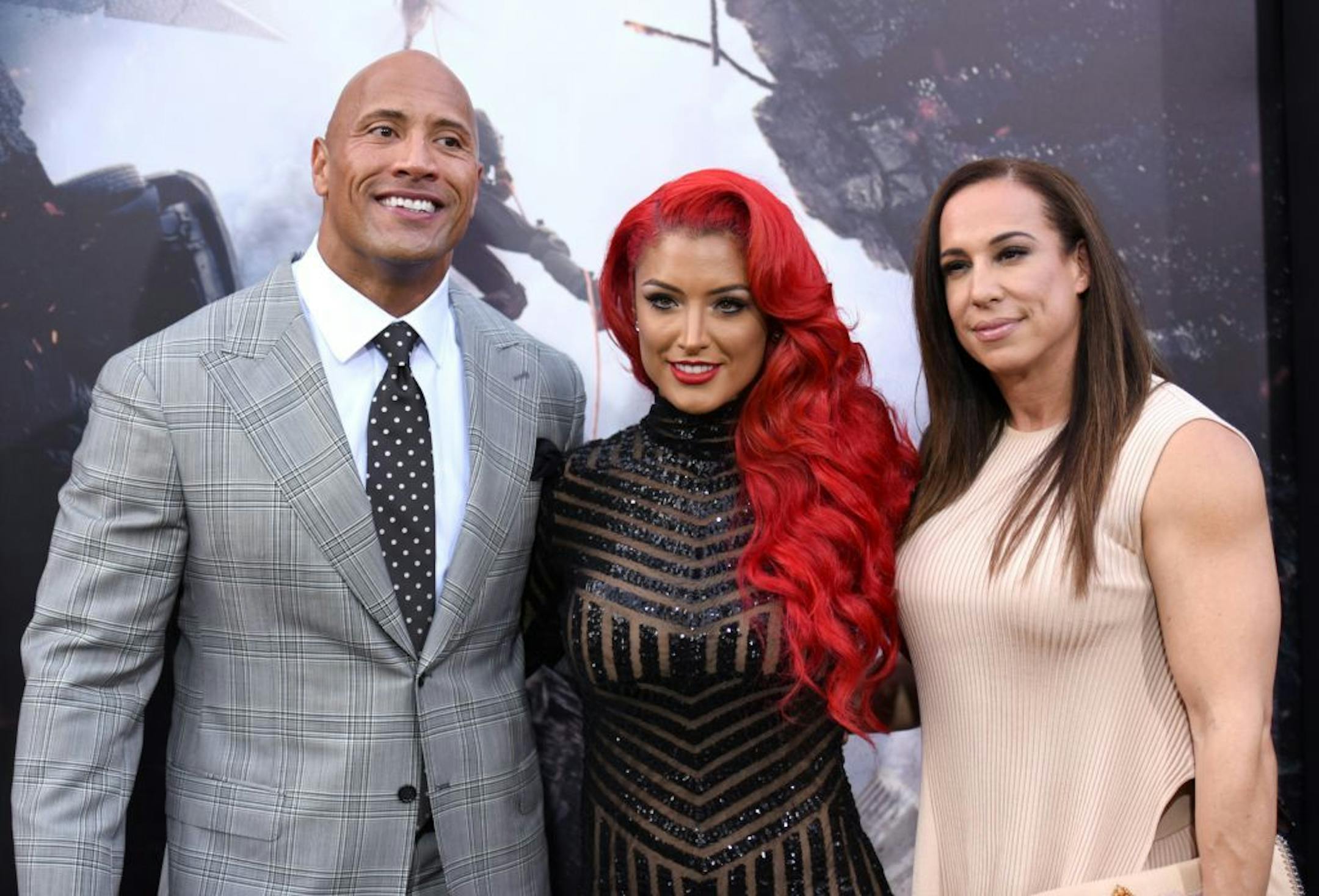 Dwayne Johnson, from left, Eva Marie and Dany Garcia arrive at the world premiere of "San Andreas" at the TCL Chinese Theatre on Tuesday, May 26, 2015, in Los Angeles.
