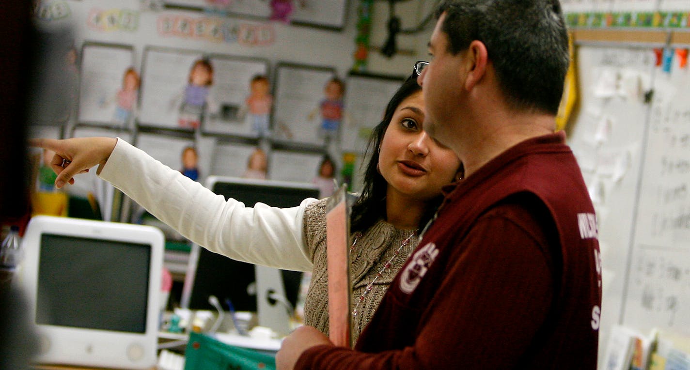 For Todd Page, spending a day volunteering at Wilson Elementary, his children's school, also gives him the opportunity to talk with their teachers, including Mrs. Anderson, who teachers his daughter Arielle, a 3rd grader.