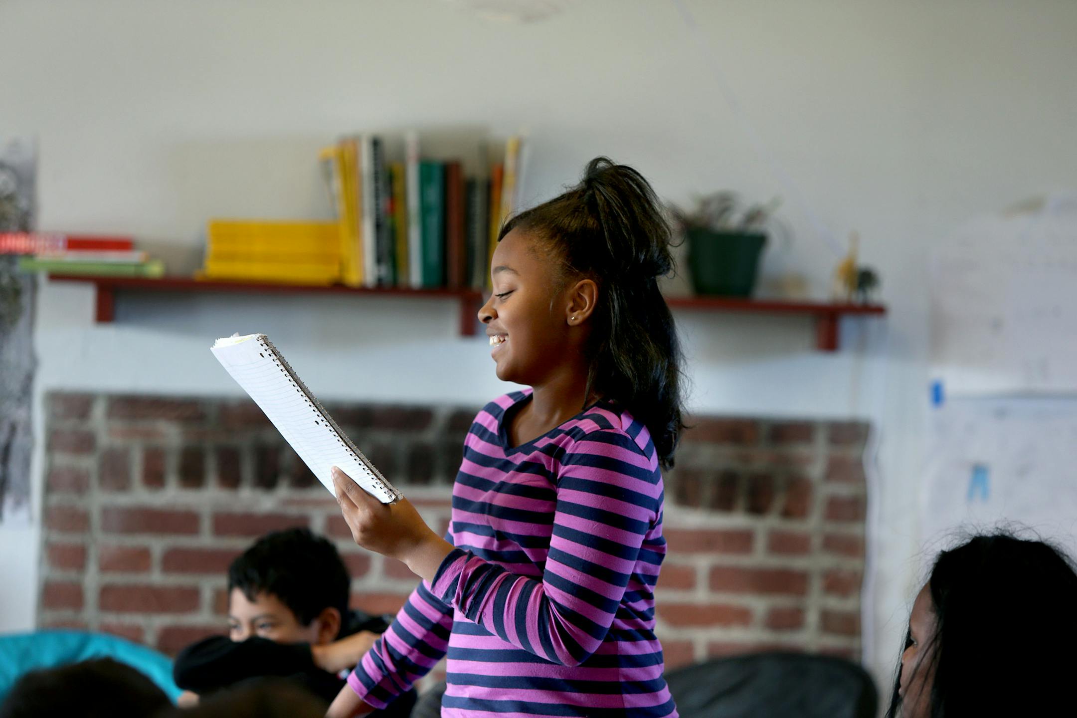 Sixth-grader Jordan Dotson, 11, read her work in front of her classmates. The Minnesota Historical Society benefited from the arrangement, getting a chance to to test its programming for school groups.