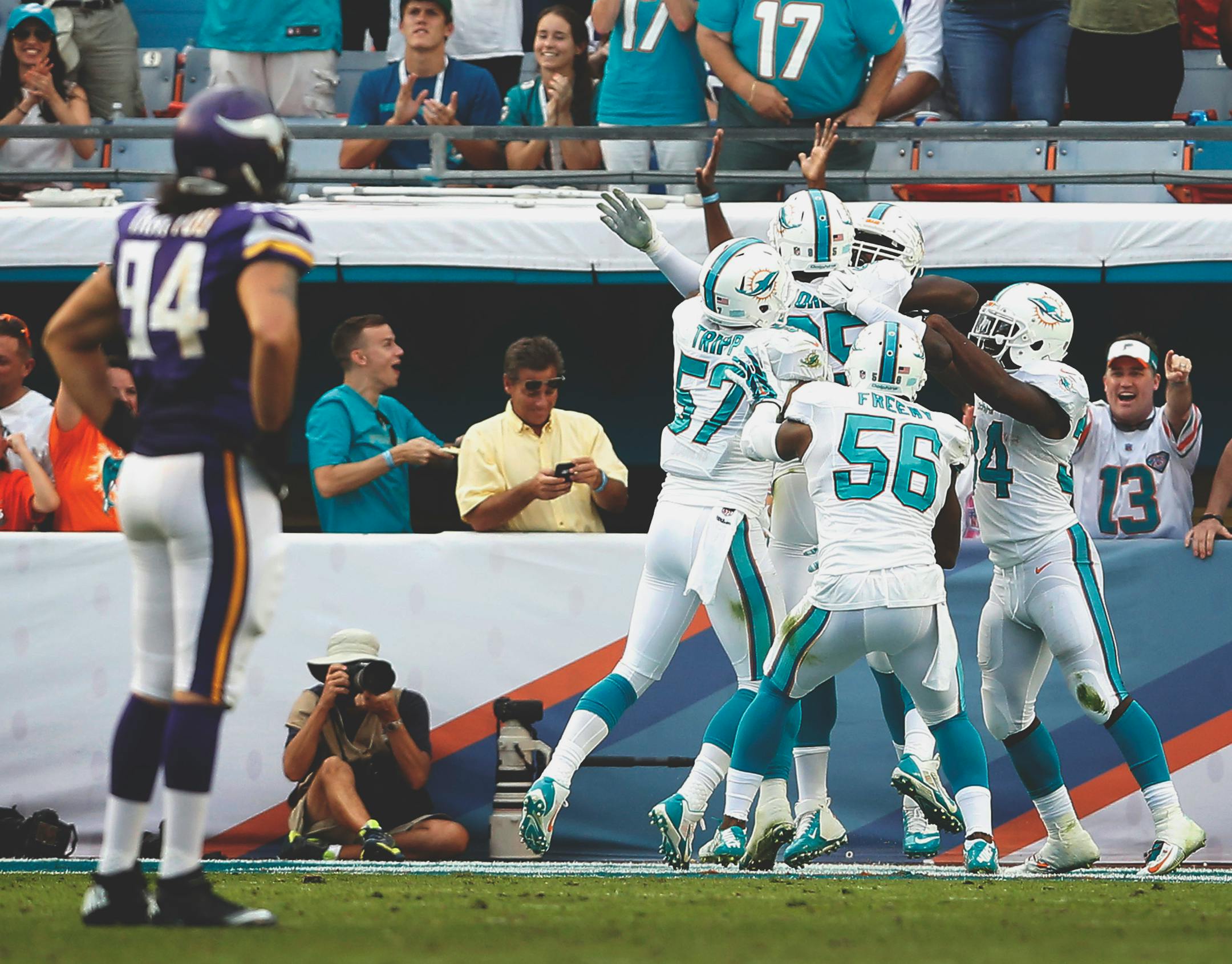 Terrence Fede (78) was mobbed by teammates after blocking a Jeff Lock punt for a safety late in the fourth quarter.
