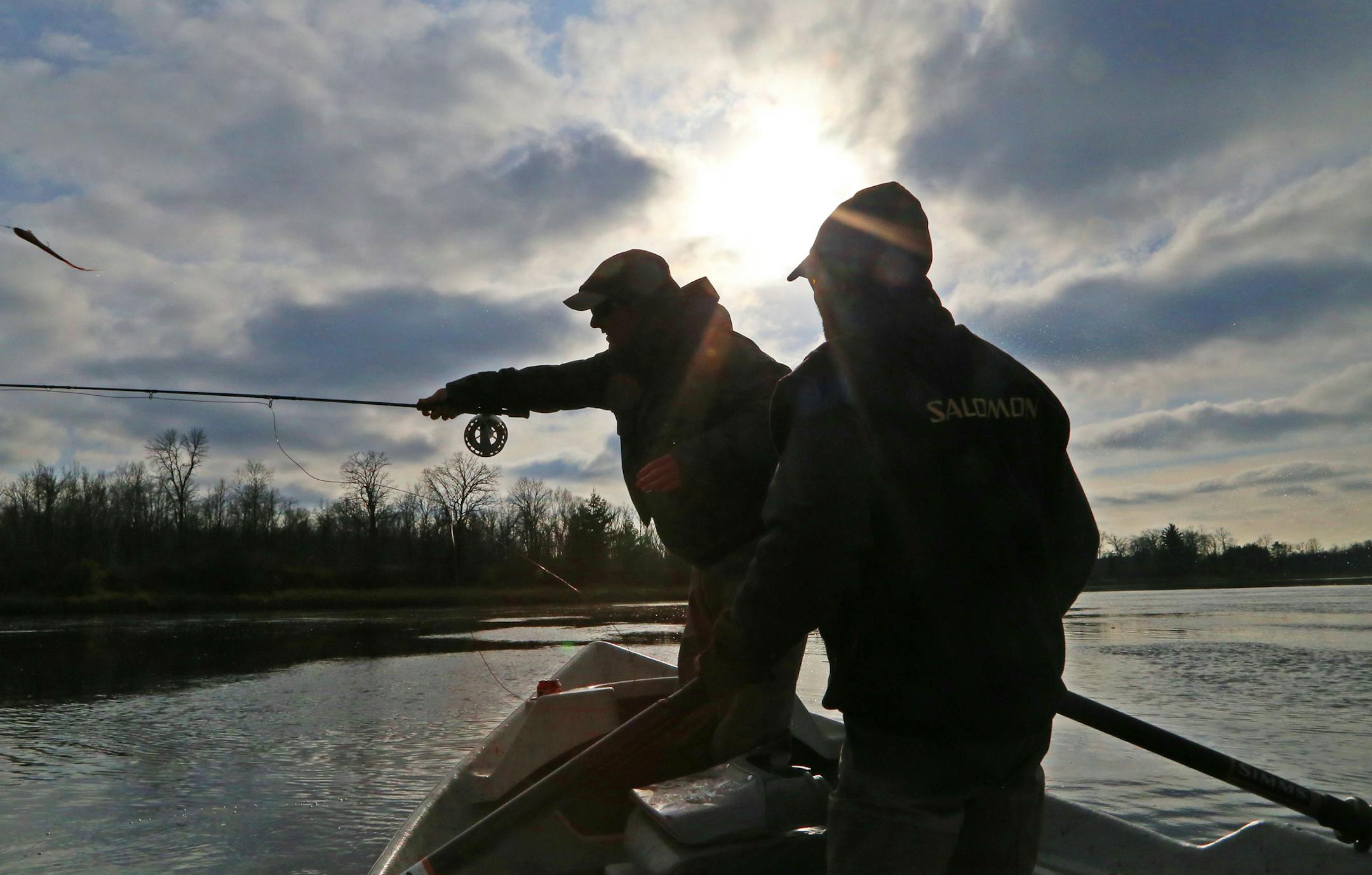 Muskie guide Gabe Schubert, right, of Stillwater watches as a 17-inch-long fly is cast toward water that might hold a trophy.